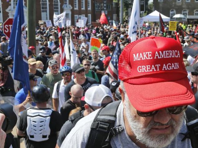 Hundreds of people chanted, threw punches, hurled water bottles and unleashed chemical sprays on each other. Photo: AP Photo/Steve Helber