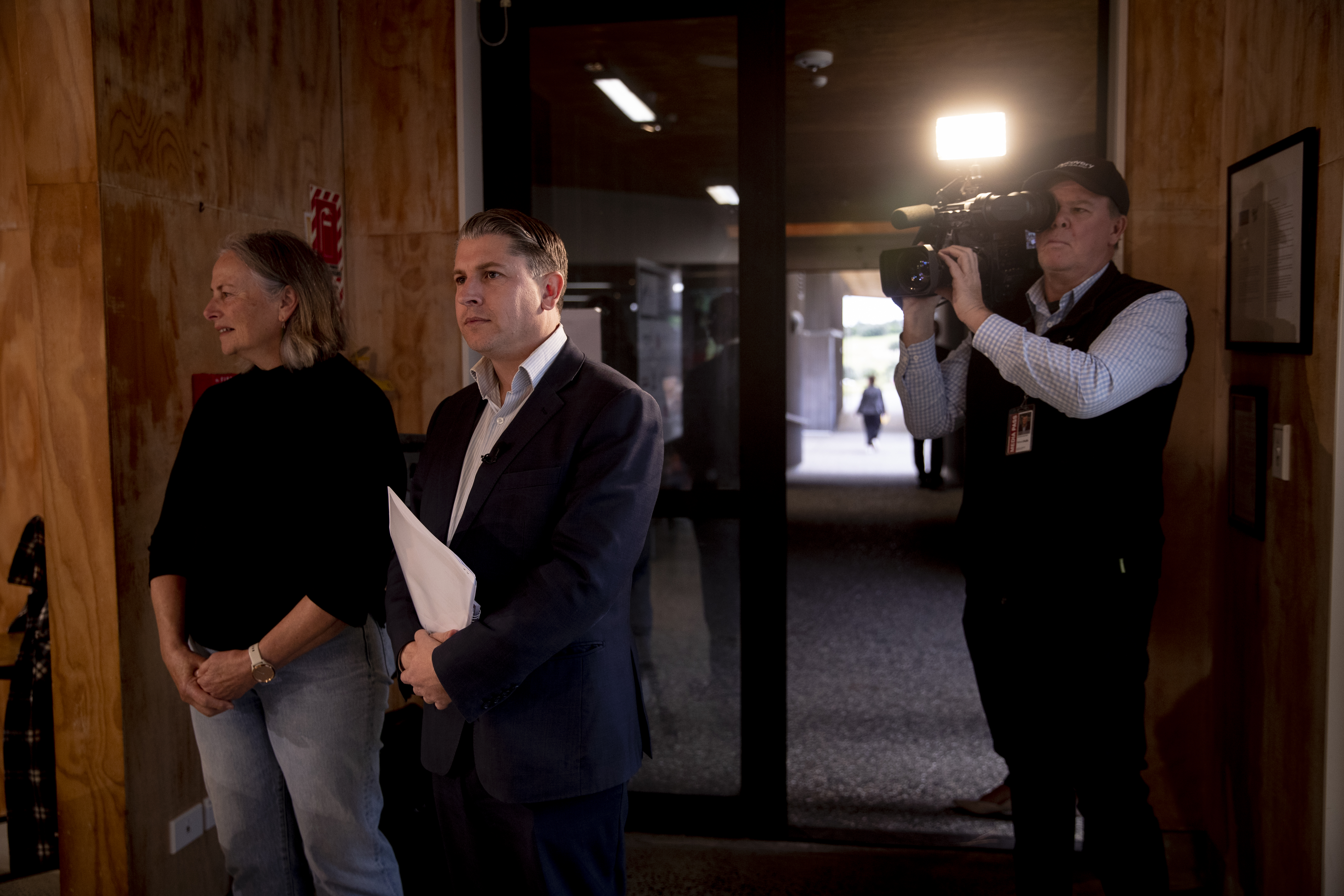 Minister for Auckland Michael Wood waiting to speak to Muriwai residents on June 16. Photo / Dean Purcell