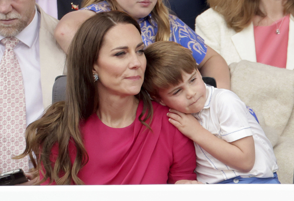 Prince Louis leans on his mother Catherine, then Duchess of Cambridge, during the Platinum Jubilee Pageant held outside Buckingham Palace on June 5, 2022. Photo / AP