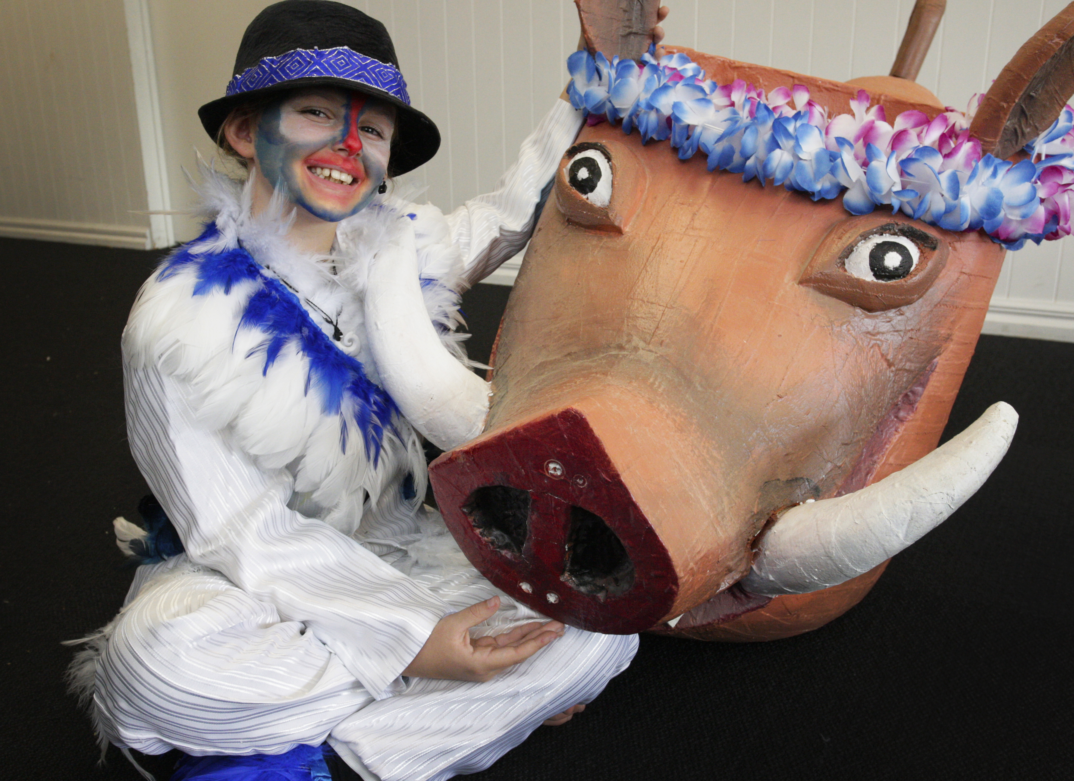 Libby Kitchen, 10, who plays Zazu, shows off one of the show's props, Pumbaa. Photo / Tania Whyte