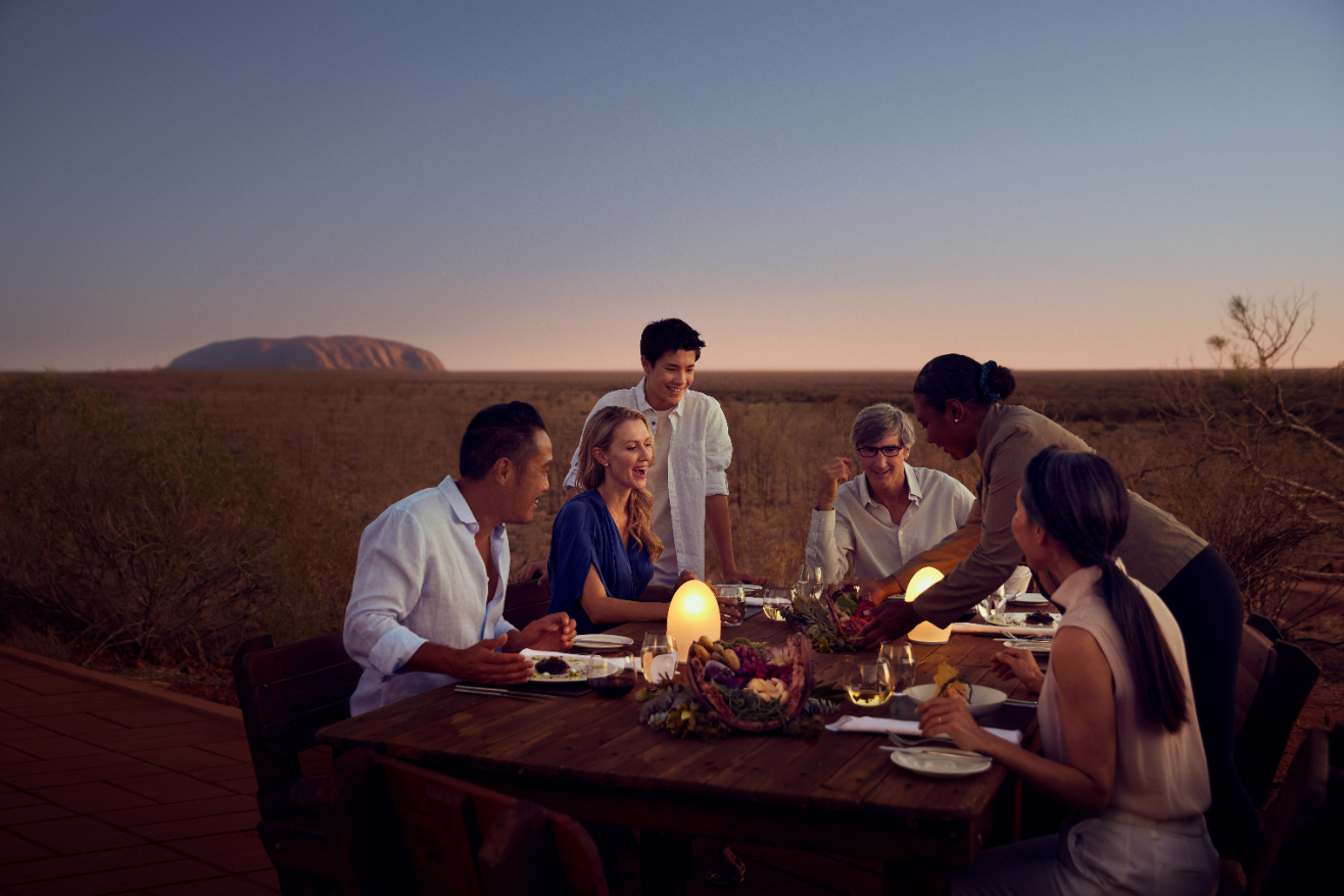 Dine amidst a breathtaking sunset at award-winning Tali Wiru dining in Central Australia. Photo / Voyages Ayers Rock Resort