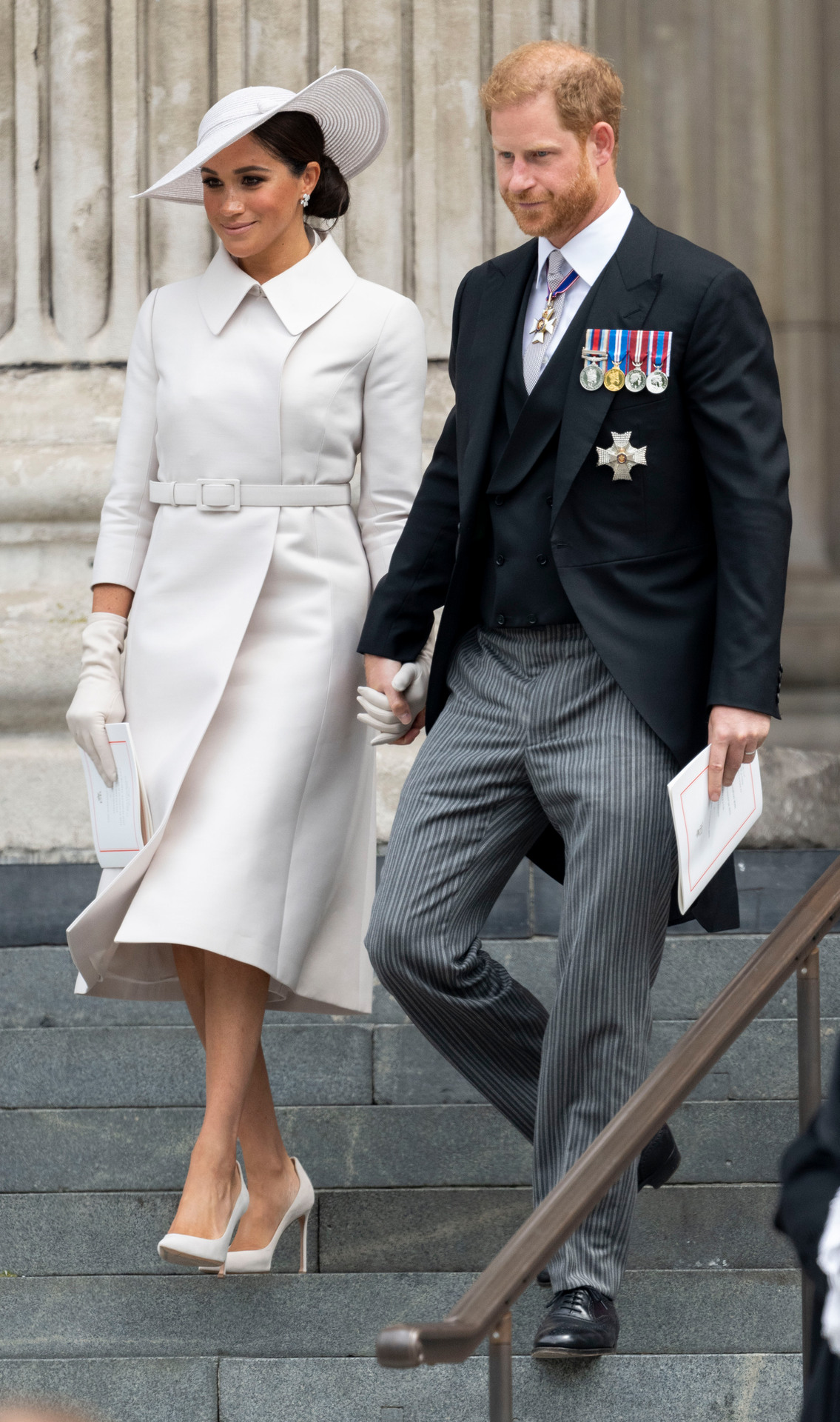 Prince Harry and Meghan Markle held hands as they made their first royal appearance since 2020. Photo / Getty Images
