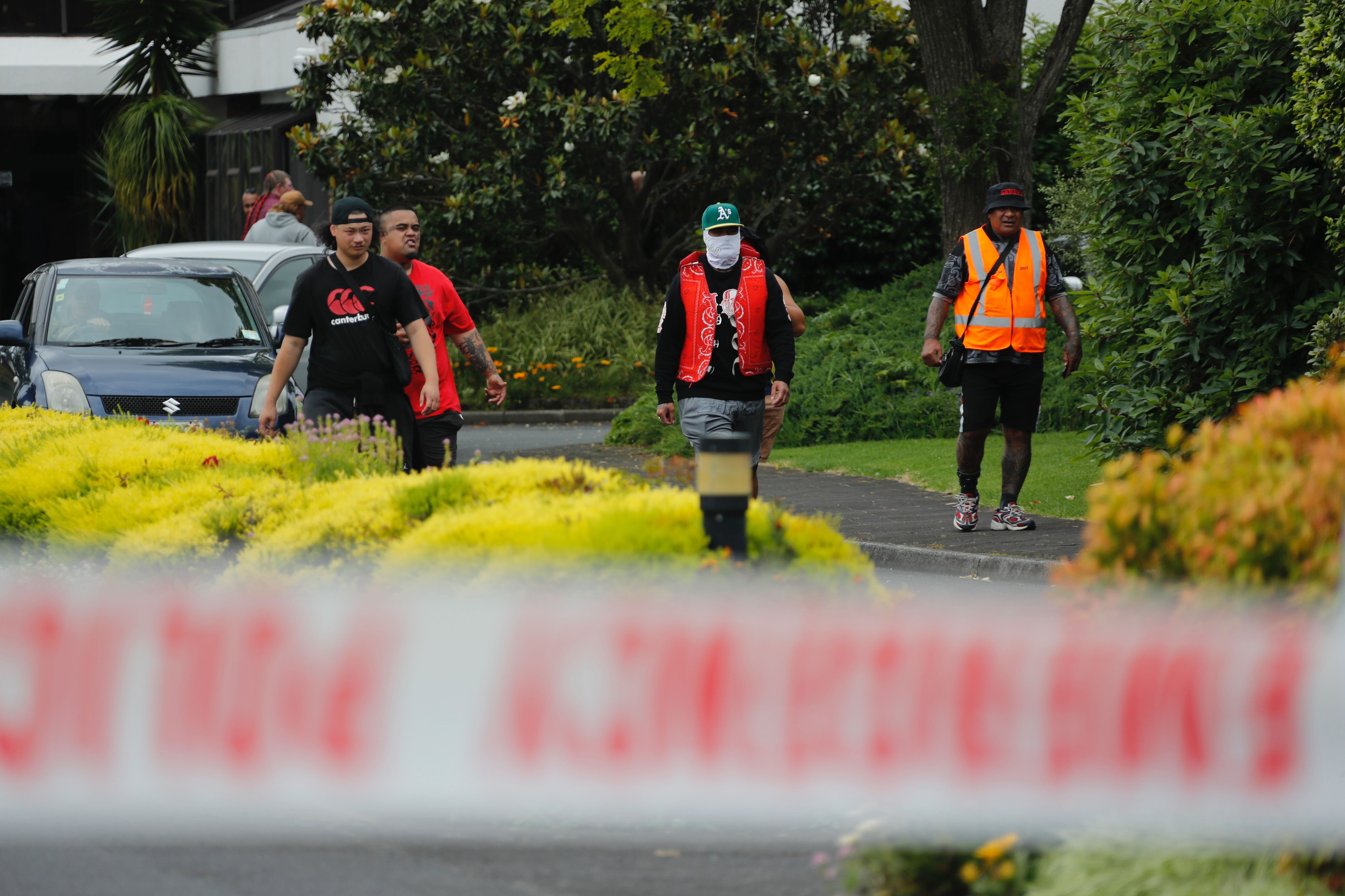 A cluster of aggravated people including several patched Mongrel Mob members are gathering at the entrance to the church. Photo / NZ Herald