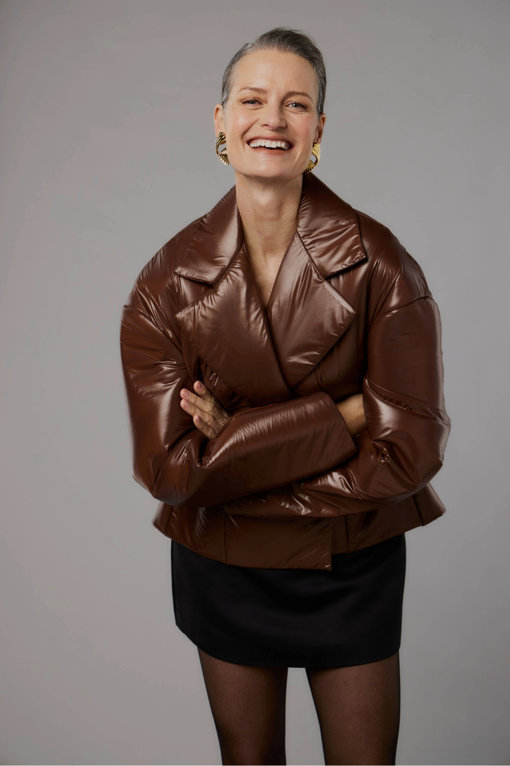 Carrie Berkey wears jacket by Adrion Atelier, Rebe mini skirt and Jasmin Sparrow earrings. Photo / Mara Sommer for New Zealand Fashion Week.