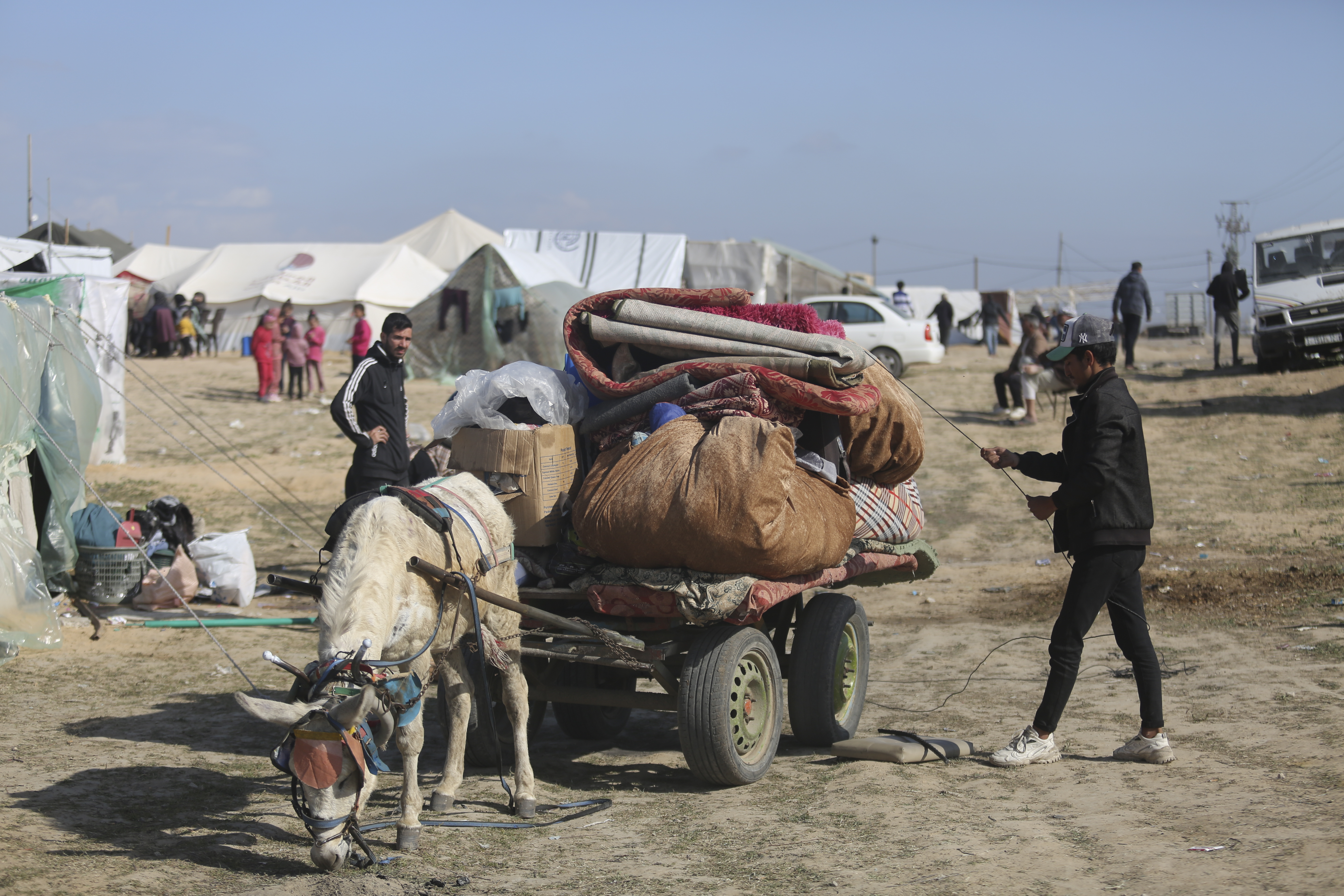 A Palestinian displaced by Israel's air and ground offensive in the Gaza Strip arrives at a temporary camp near Kerem Shalom crossing in Rafah. Photo / AP