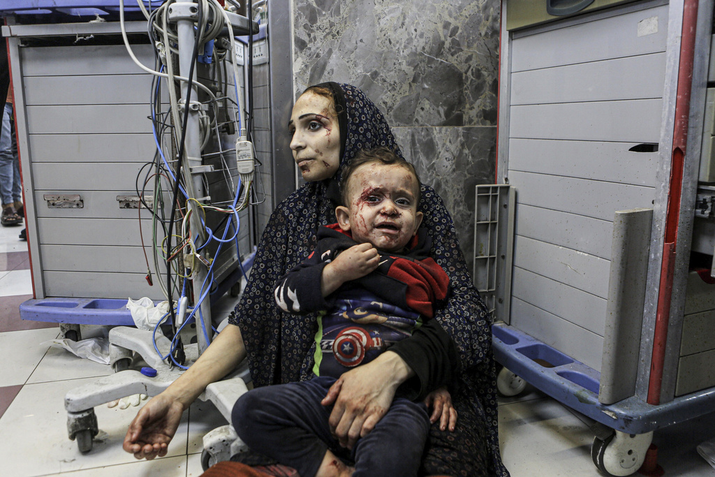 Wounded Palestinians wait for treatment, at the al-Shifa hospital, in Gaza City on October 17. Photo / AP