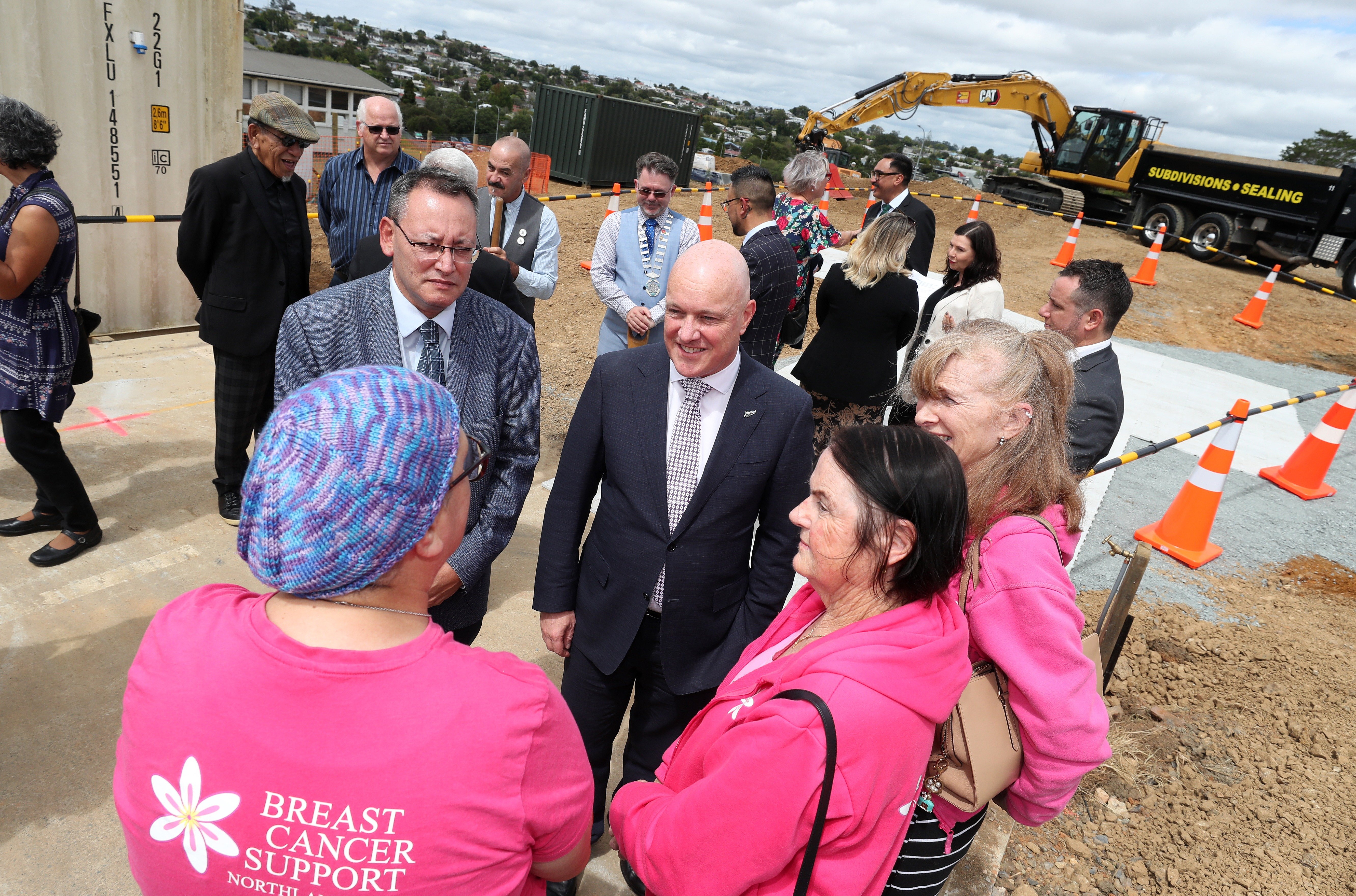 Breast Cancer Support Trust chairwoman Carol Roland, centre, and fellow members speak with Reti and Luxon during a sod-turning ceremony for the new radiation cancer facility in Whangārei in March. Photo / Michael Cunningham