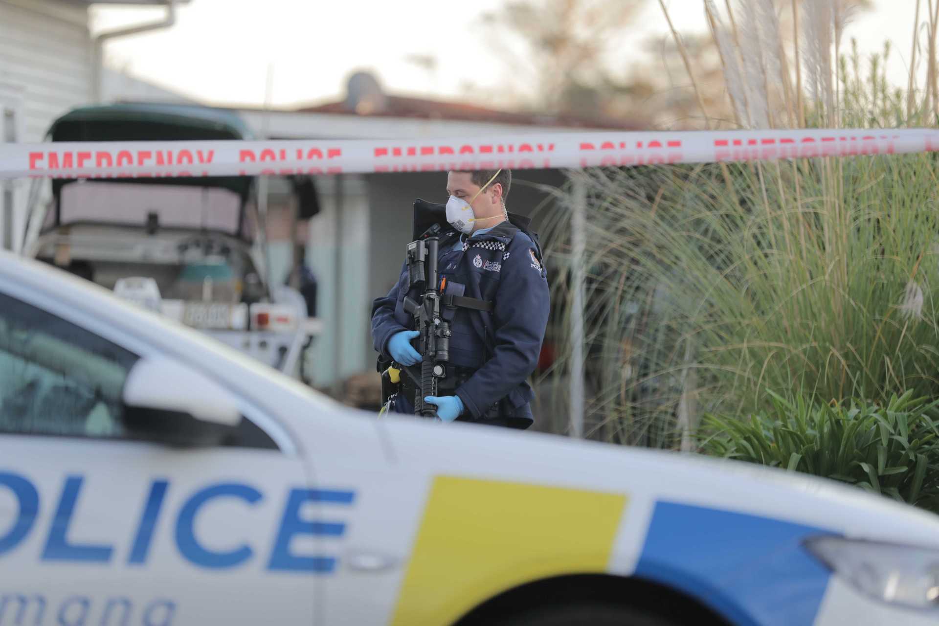 Armed police at the scene of the shooting this morning. Photo / Michael Craig