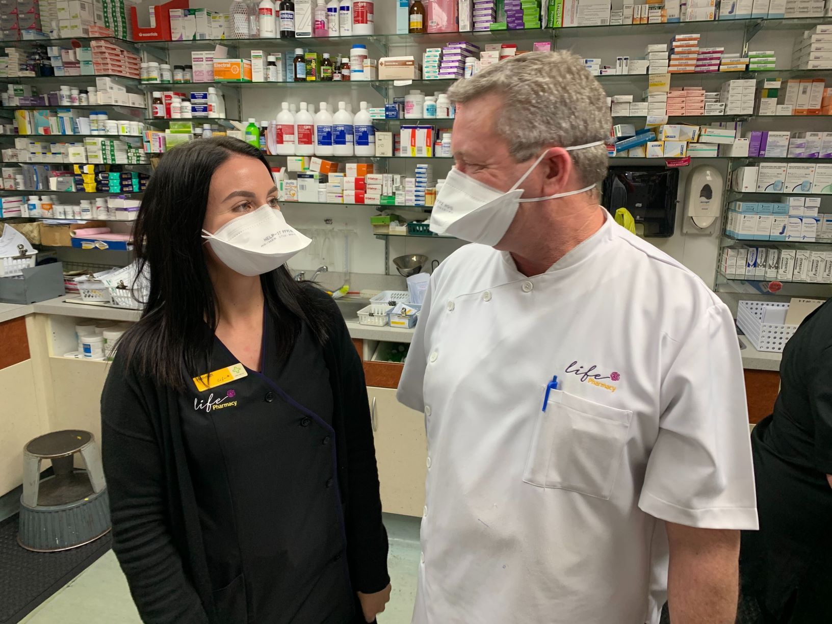 Pharmacy staffers wearing KN95 disposable masks. Photo / NZME