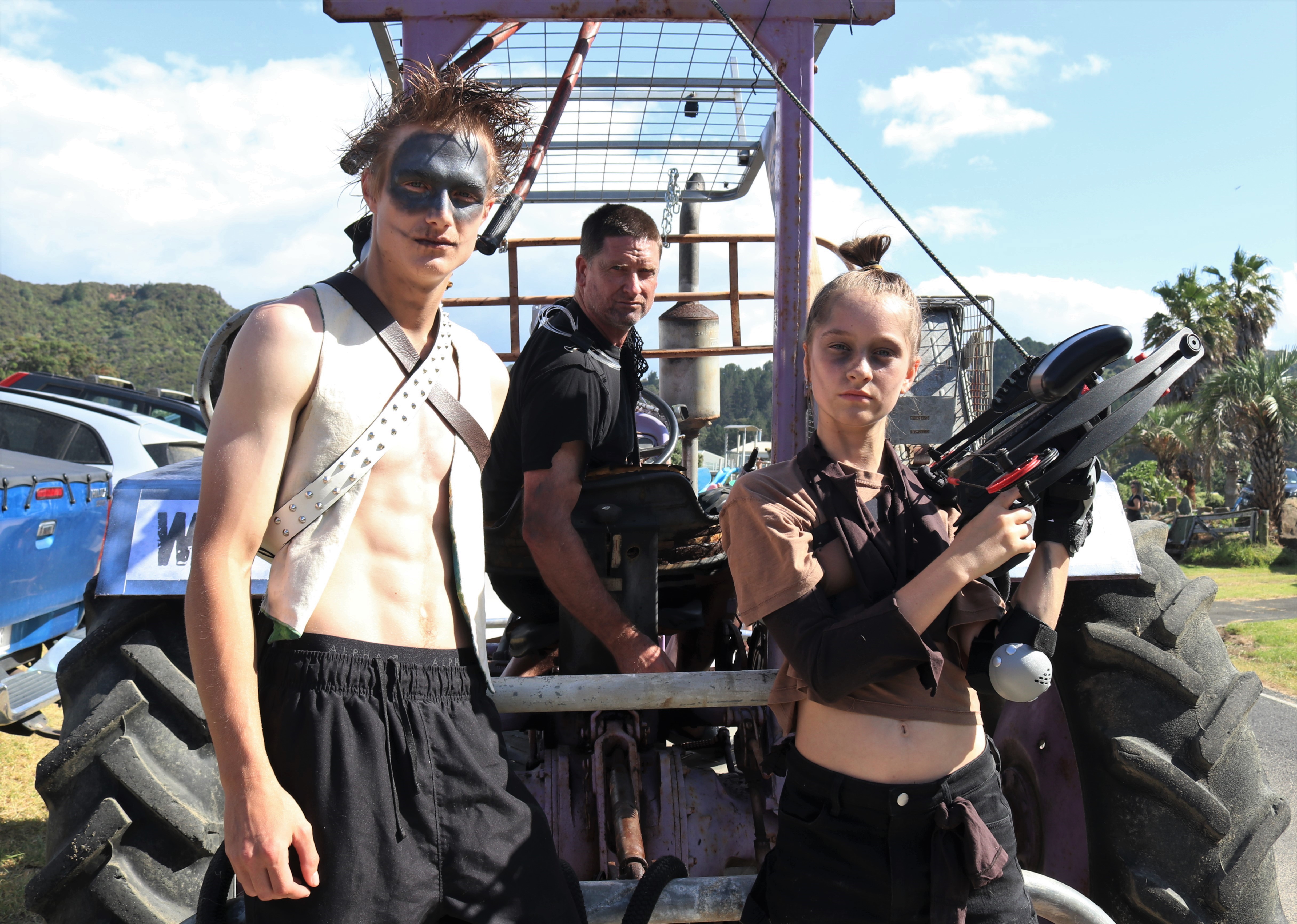 The Taupō Bay Campground crew — from left, Adam McCarroll, Jon Urlich and Ava Urlich — won the best-decorated tractor title for their War Rig from the movie Mad Max: Fury Road. Photo / Peter de Graaf