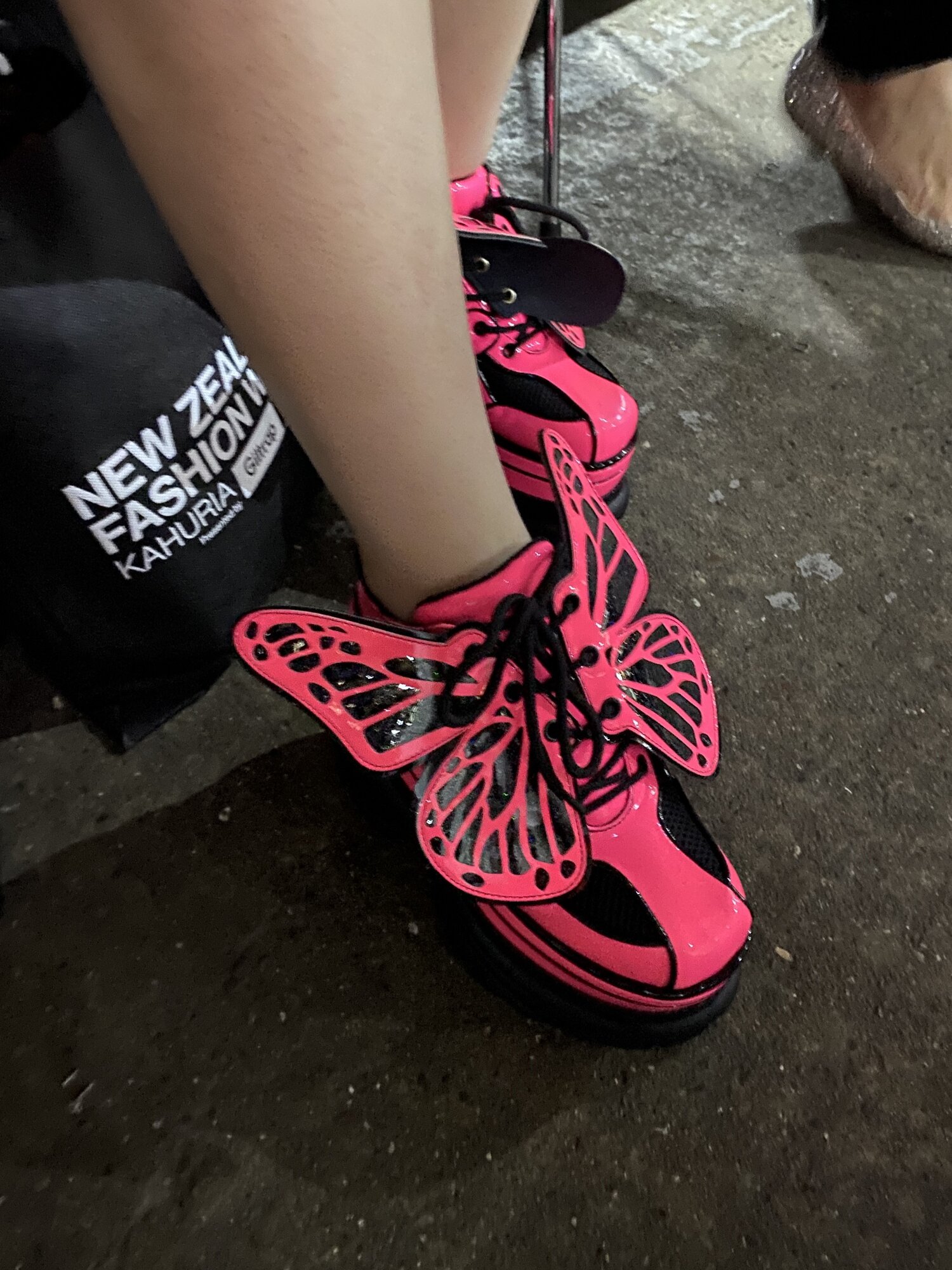 Club Exx shoes from the Dolls Kill online store, as worn by Inessa in the Claudia Li front row at New Zealand Fashion Week 2025.