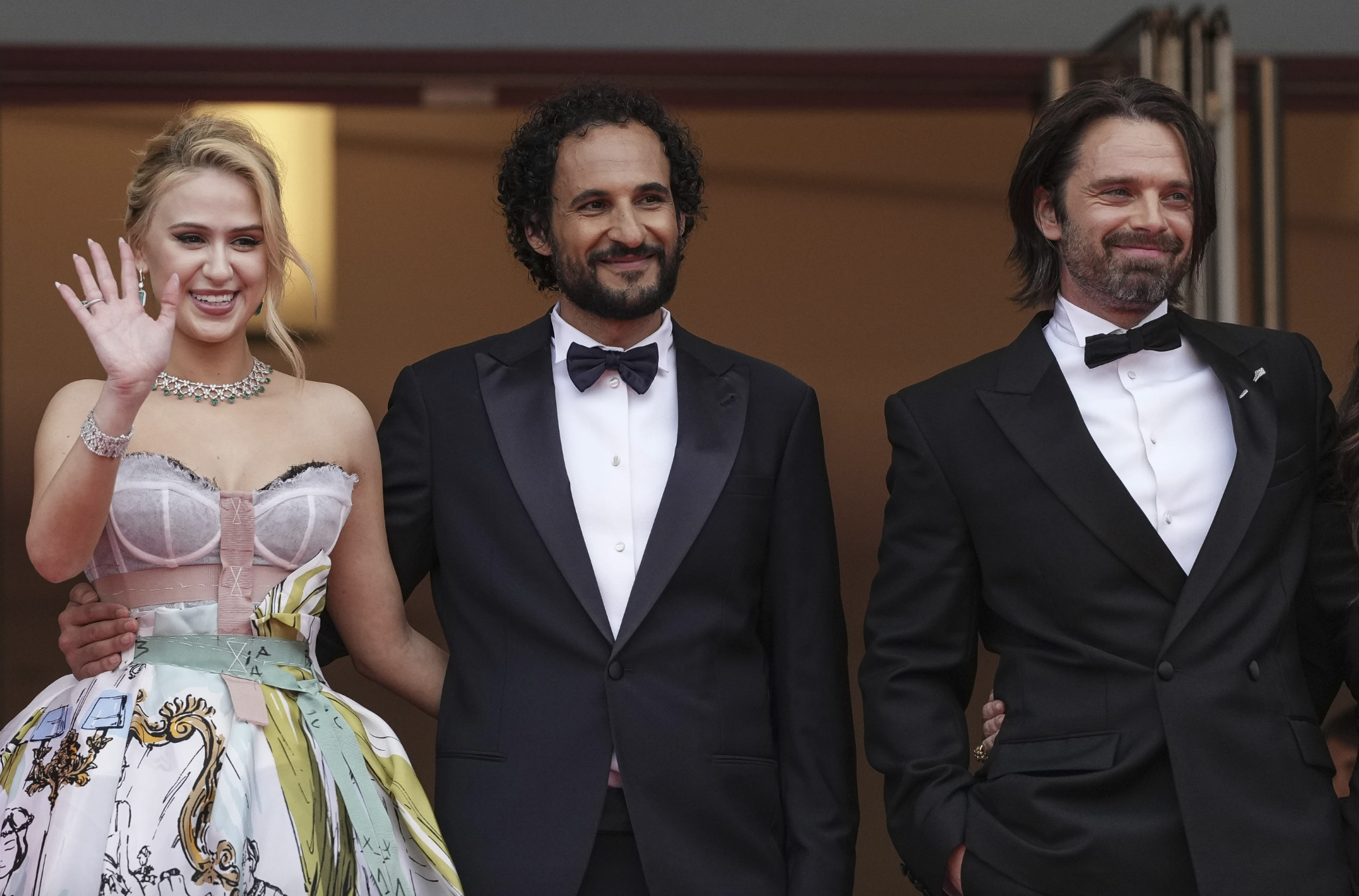 Maria Bakalova, from left, director Ali Abbasi and Sebastian Stan pose for photographers at the premiere of the film The Apprentice at the 77th International film festival, Cannes, southern France, on Monday, May 20. Photo / AP