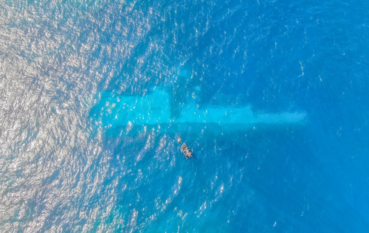 Royal NZ Navy divers surveying the area around HMNZS Manawanui on the Southern Coast of Upolu, Samoa as part of Operation Resolution. Photo / NZDF