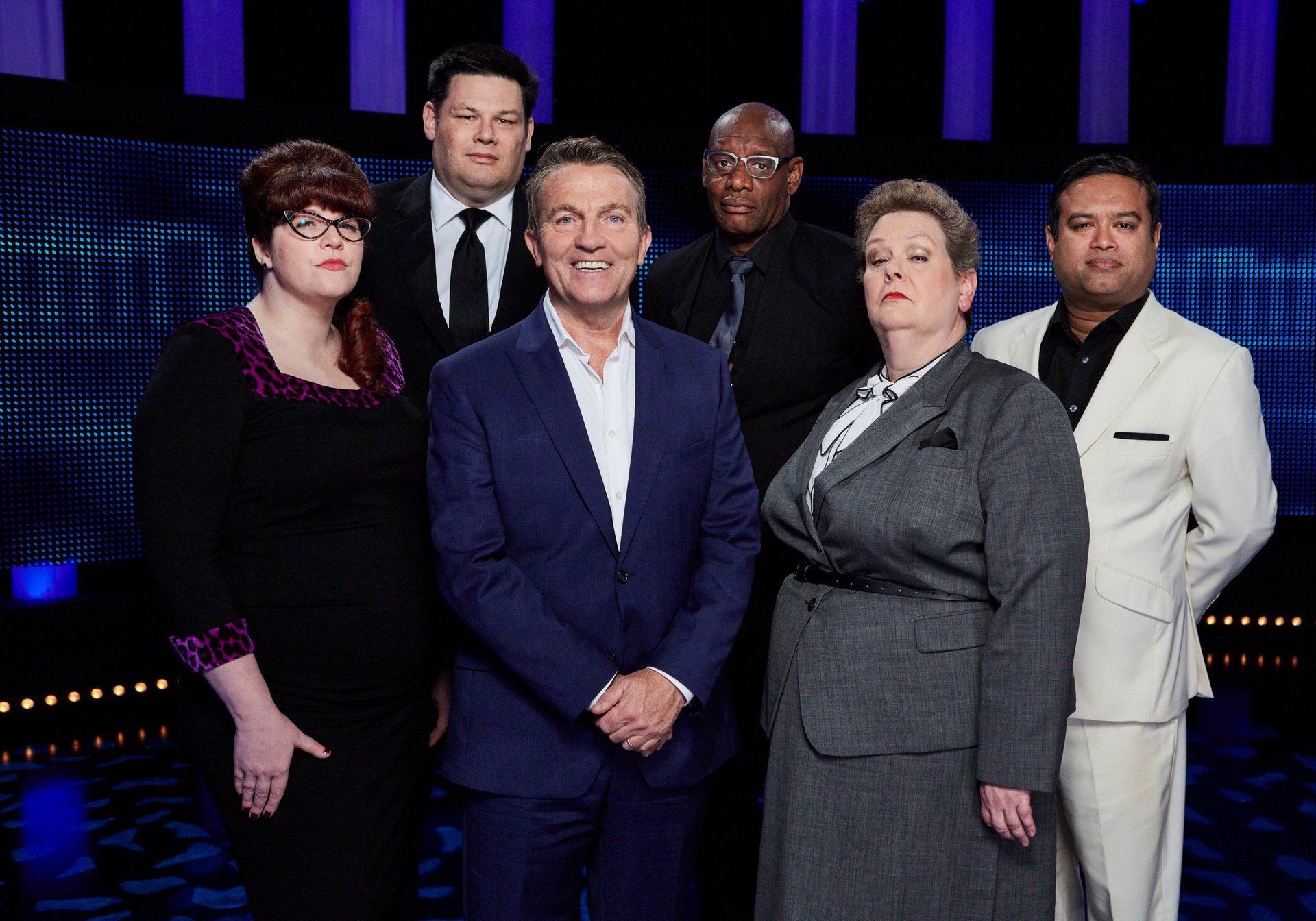 The Chase host Bradley Walsh and five of the six chasers.