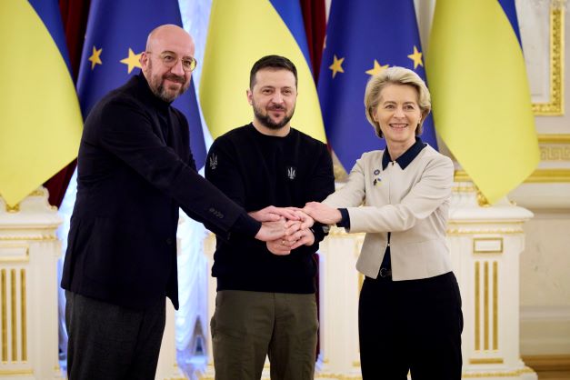 Ukrainian President Volodymyr Zelenskyy, centre, European Commission President Ursula von der Leyen, right, and European Council President Charles Michel shake hands during the EU-Ukraine summit in Kyiv, Ukraine, on Friday. Photo / via AP