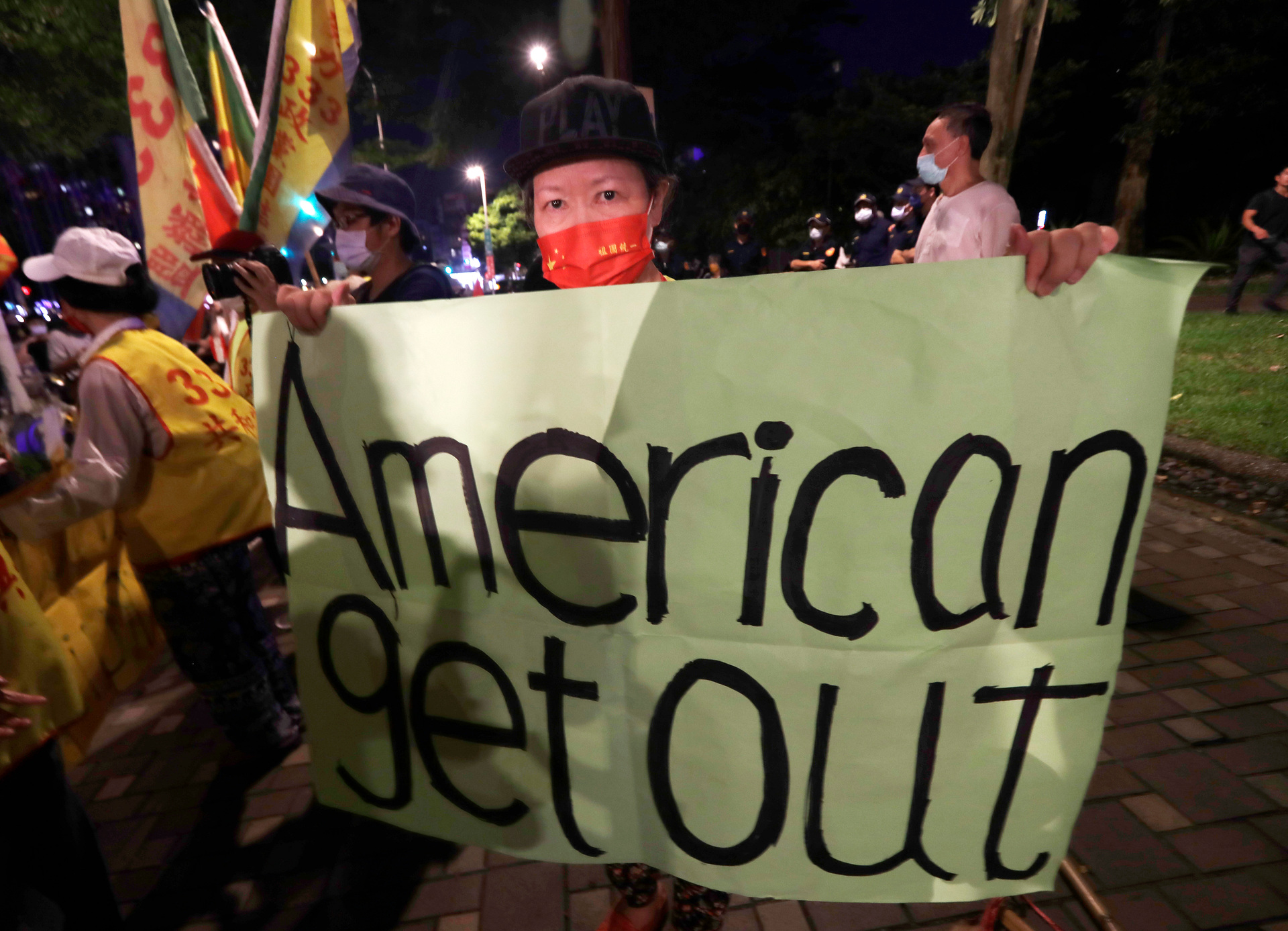 A protester holds a banner opposing the visit of United States House Speaker Nancy Pelosi, outside a hotel in Taipei. Photo / Chiang Ying-ying, AP