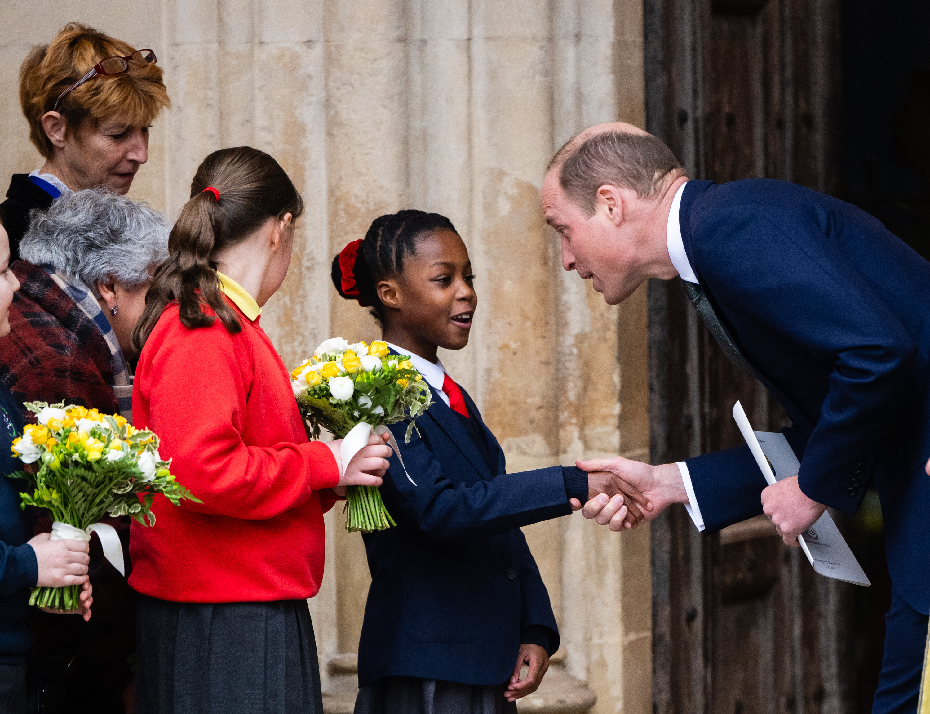 The Prince of Wales greets school children as he leaves the annual Commonwealth Day Service at Westminster Abbey. Photo / Getty Images