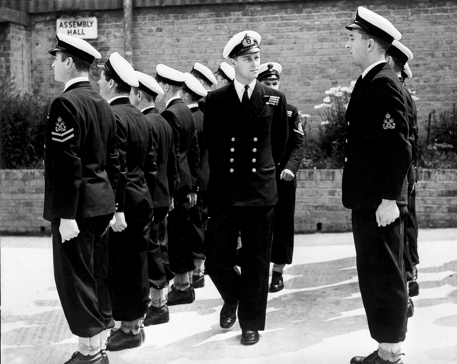 Lieut. Philip Mountbatten, as he was then called, inspects his men at the Petty Officers' Training Center at Corsham, England in 1947. Photo / AP