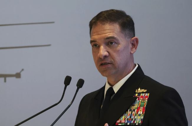 U.S. Navy Vice Adm. Brad Cooper, who heads the Navy's Bahrain-based 5th Fleet, speaks at an event at the International Defense Exhibition and Conference in Abu Dhabi, United Arab Emirates, Feb. 21, 2023. The top commander of U.S. naval forces in the Middle East says Yemen’s Houthi rebels are showing no signs of ending their “reckless” attacks on commercial ships in the Red Sea. But Vice Adm. Brad Cooper said in an Associated Press interview on Saturday that more nations are joining the international maritime mission to protect vessels in the vital waterway and trade traffic is beginning to pick up. (AP Photo/Jon Gambrell, File)