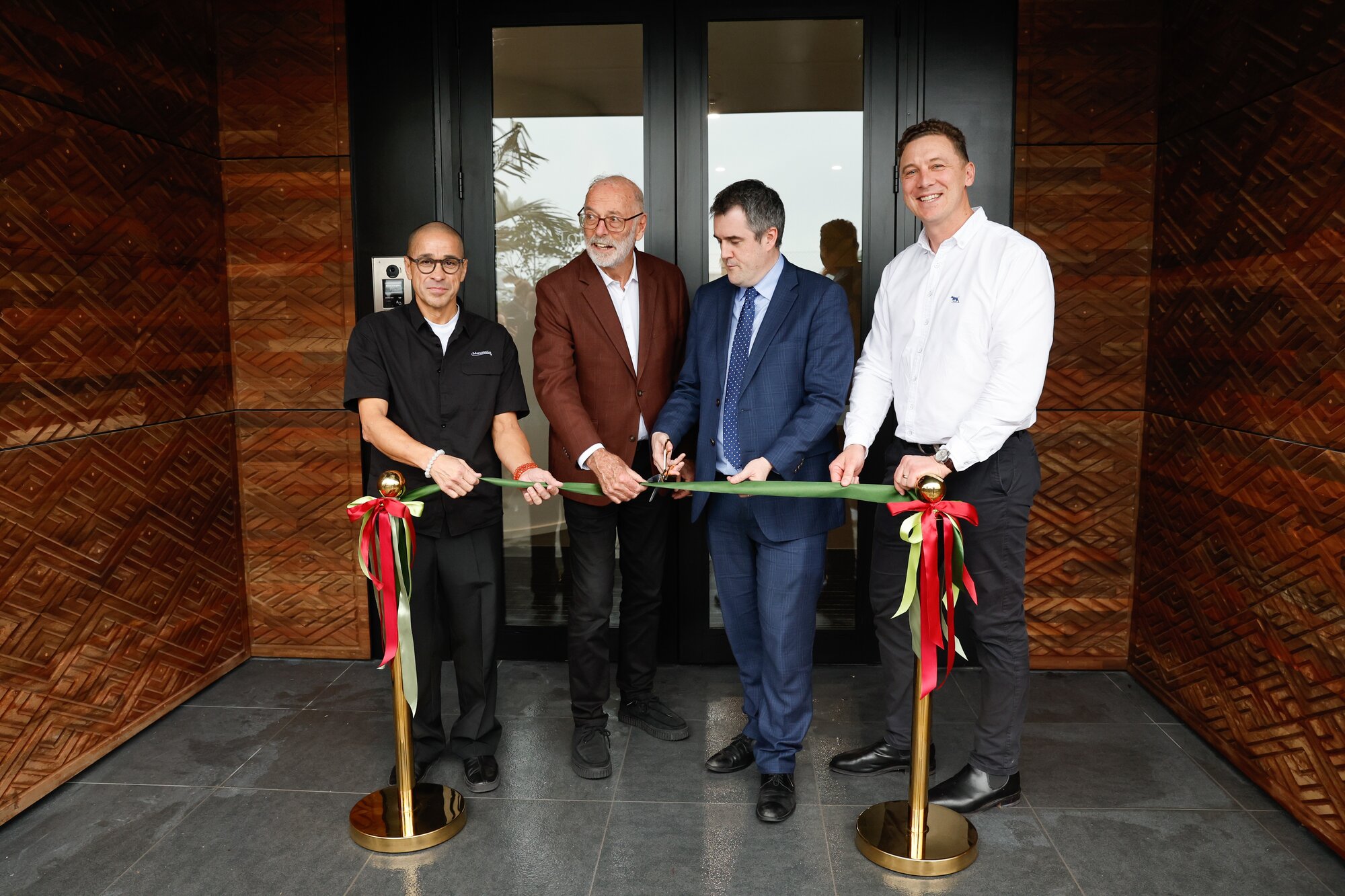 VIPs at the opening of the Toi high-rise (from left): Marutūāhu chair Paul Majurey, Auckland Mayor Wayne Brown, Minister Chris Bishop, and Ockham Residential chief William Deihl. Photo / Sylvie Whinray 