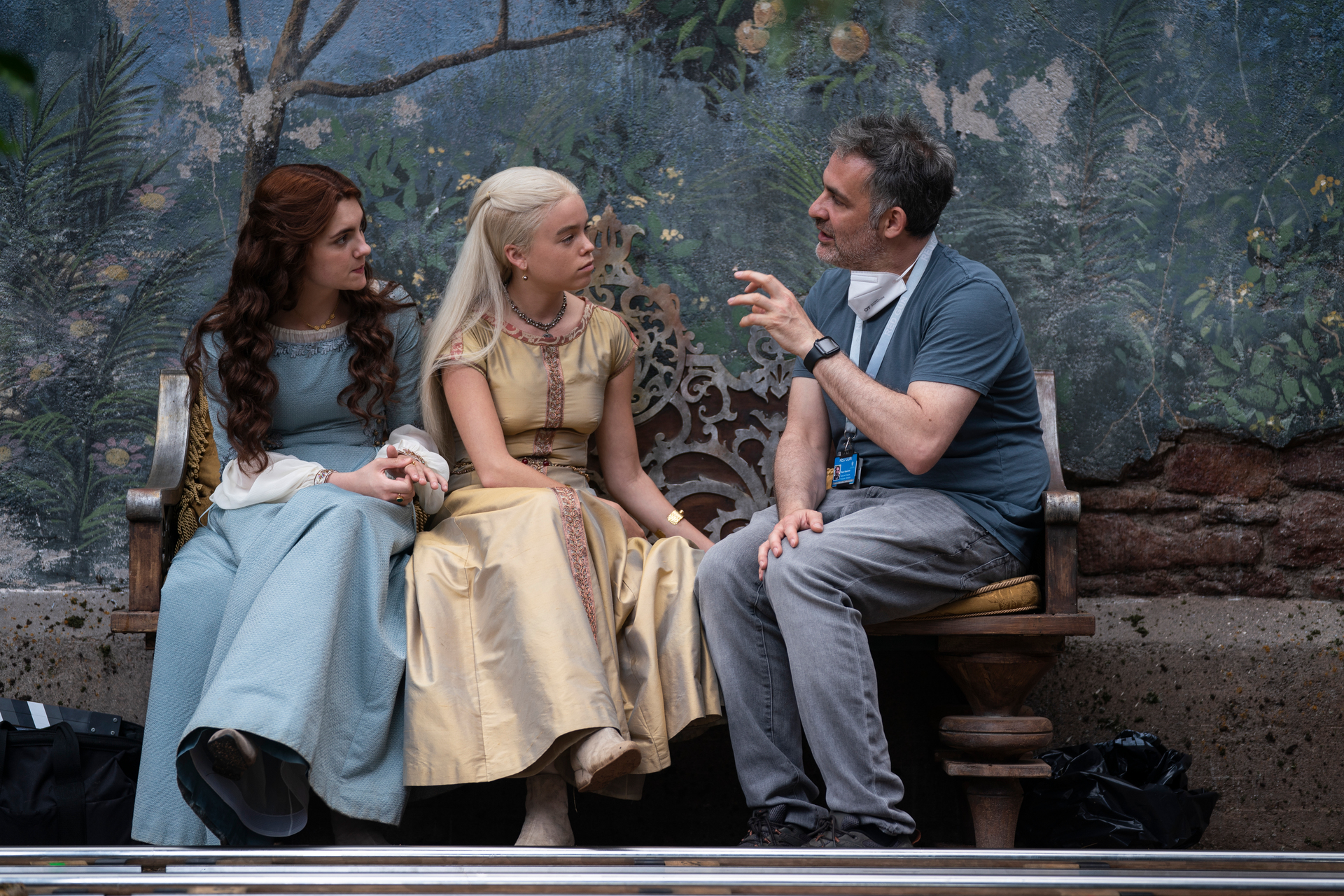 Emily Carey, Milly Alcock and showrunner Miguel Sapochnik behind the scenes of The House of the Dragon.