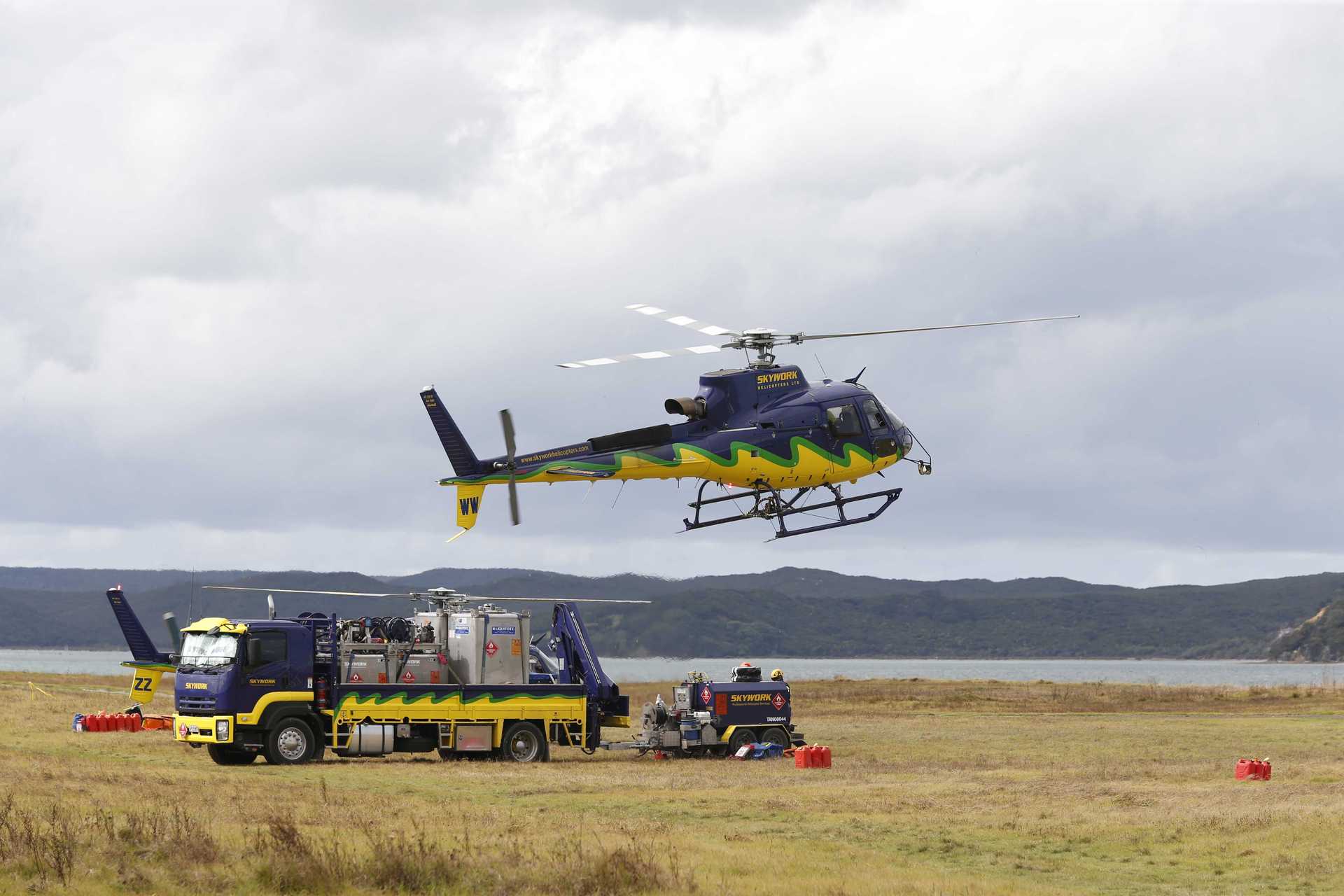 A helicopter returns with the latest victim in Te Pua, Far North. Photo / Michael Cunningham