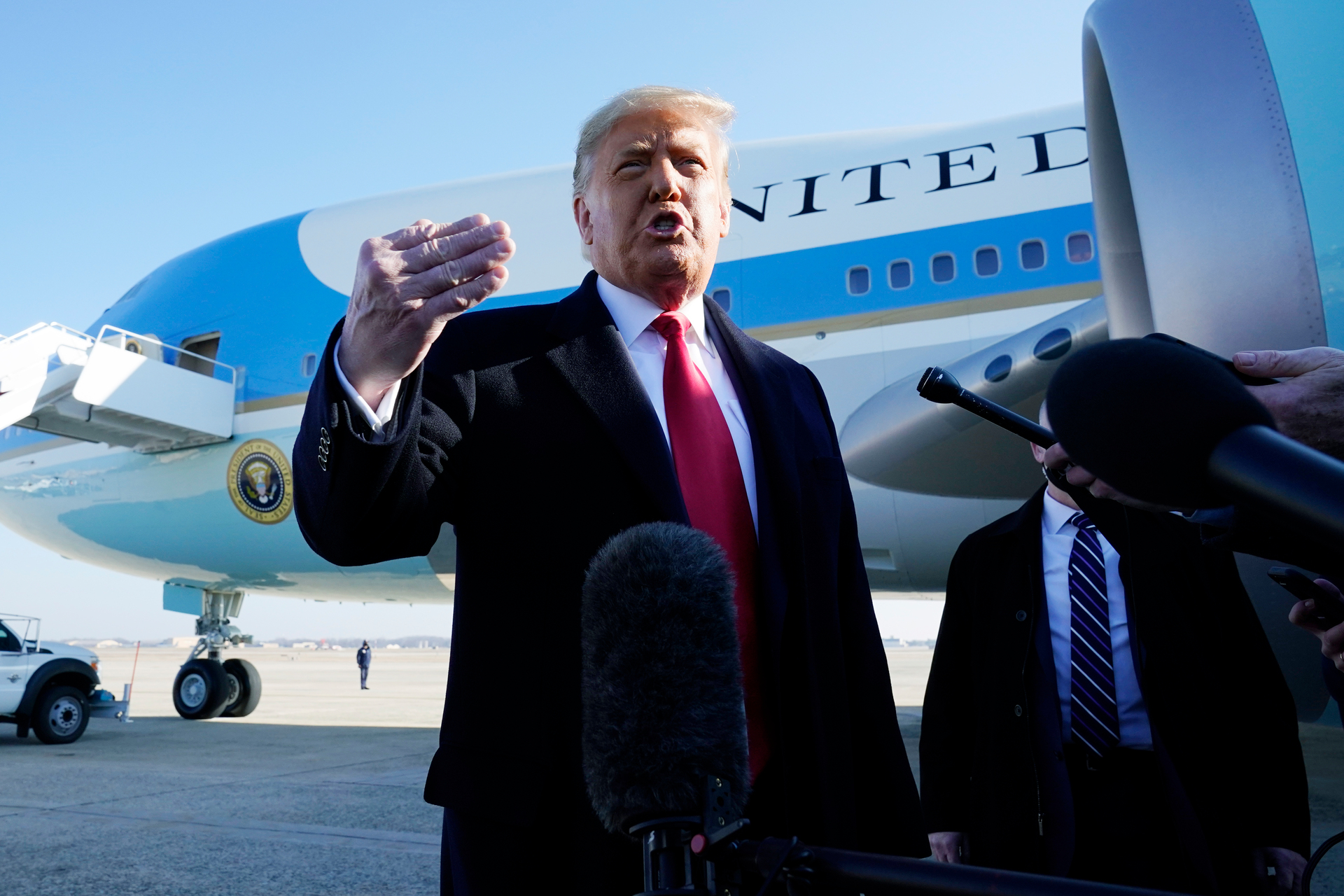 President Donald Trump speaks to the media before boarding Air Force One, at Andrews Air Force Base. Photo / AP