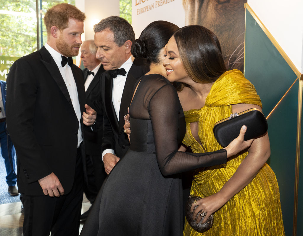 Prince Harry, Duke of Sussex (L) chats with Disney CEO Robert Iger as Meghan, Duchess of Sussex (2nd R) embraces Beyonce Knowles-Carter (R). Photo / Getty Images.