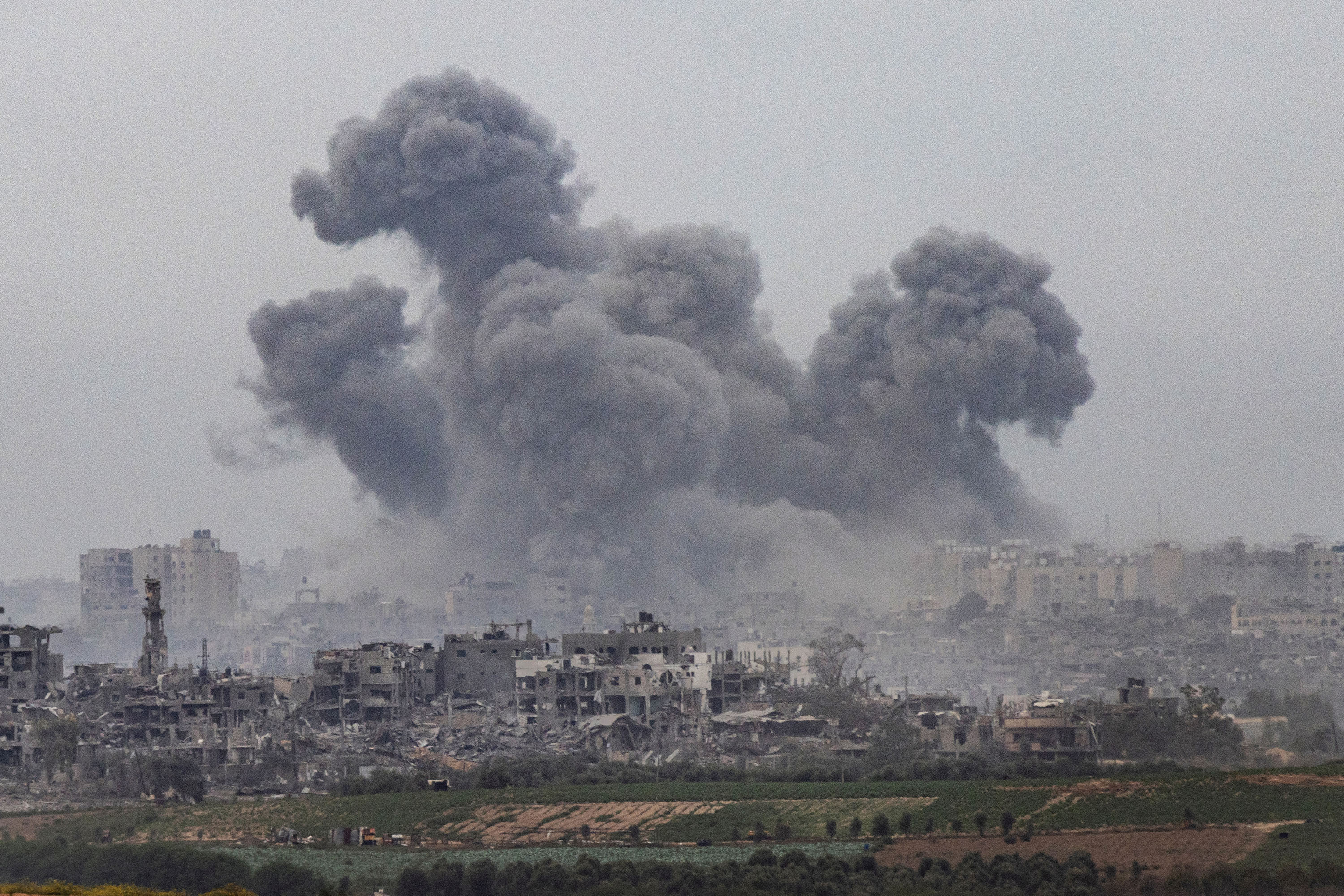 Northern Gaza after an Israeli airstrike as seen from Sderot, Israel, last month. Photo / Tamir Kalifa, The New York Times