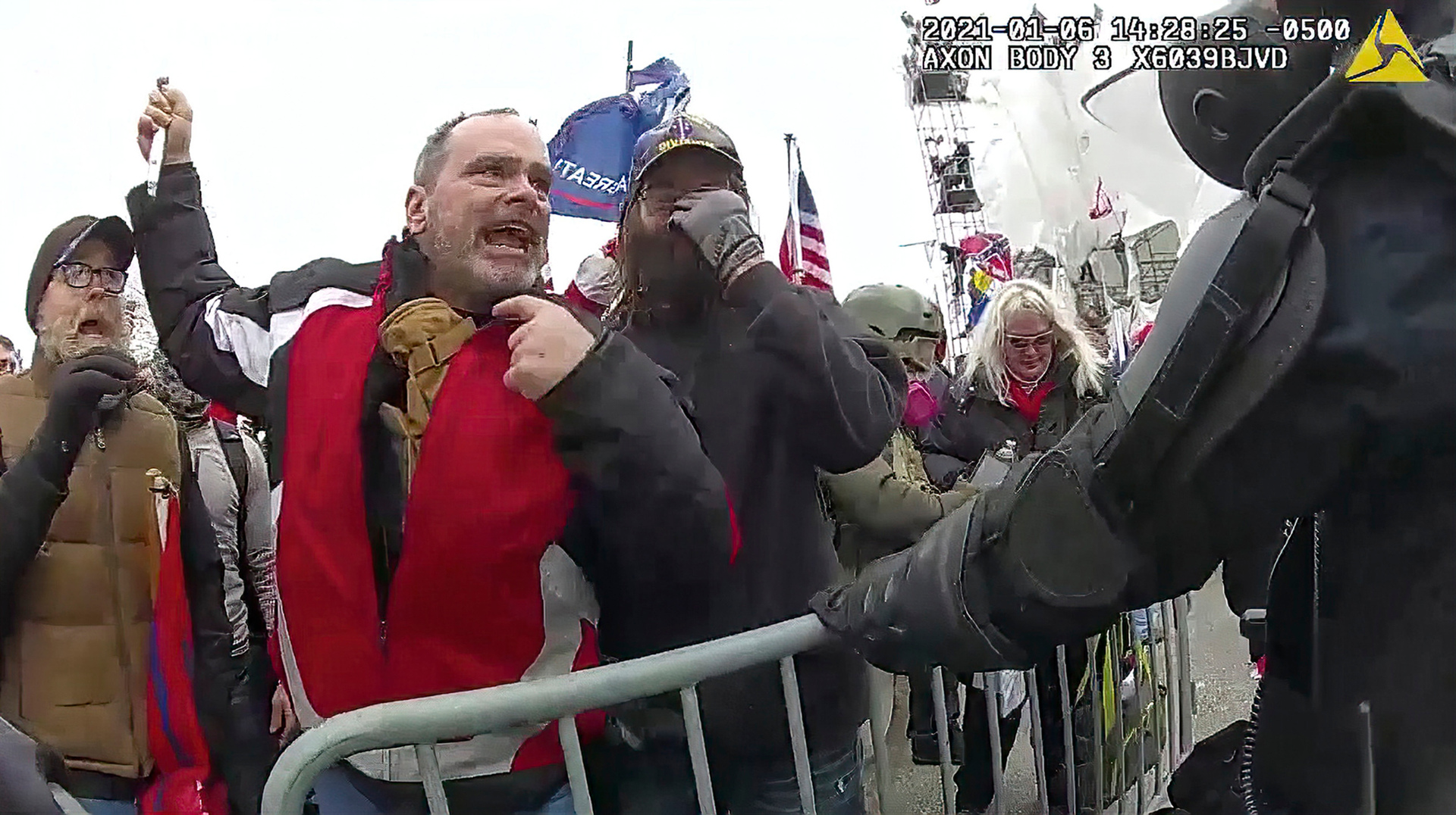 This still frame from a Metropolitan Police officer's body camera video shows Thomas Webster, in red jacket, at a barricade on the west front of the US Capitol. Photo / AP