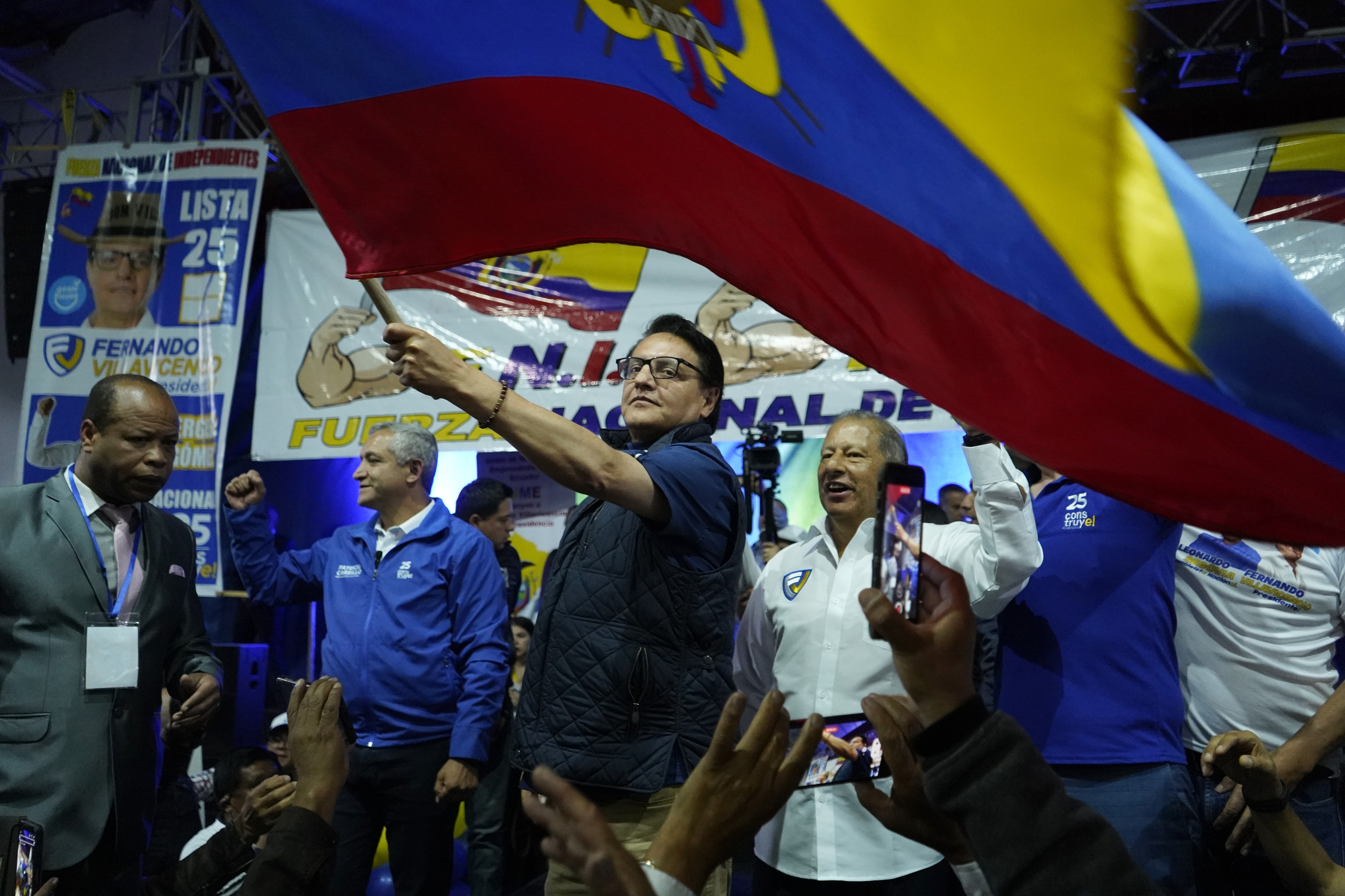 Presidential candidate Fernando Villavicencio waves an Ecuador national flag during a campaign event at a school minutes before he was shot to death outside the same school in Quito, Ecuador. Photo / AP