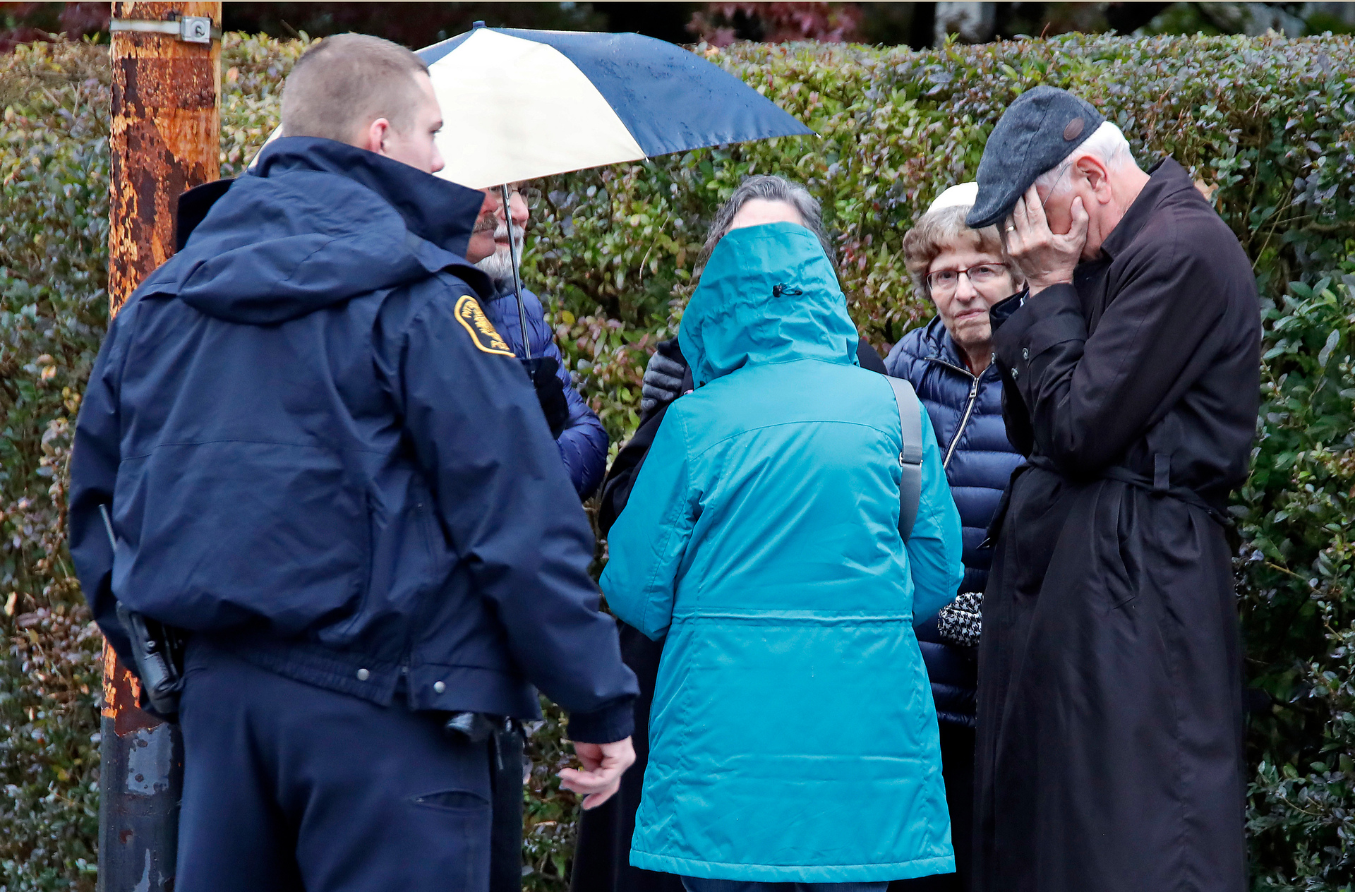 People gather on a corner near the Tree of Life Synagogue in Pittsburgh. Photo / AP