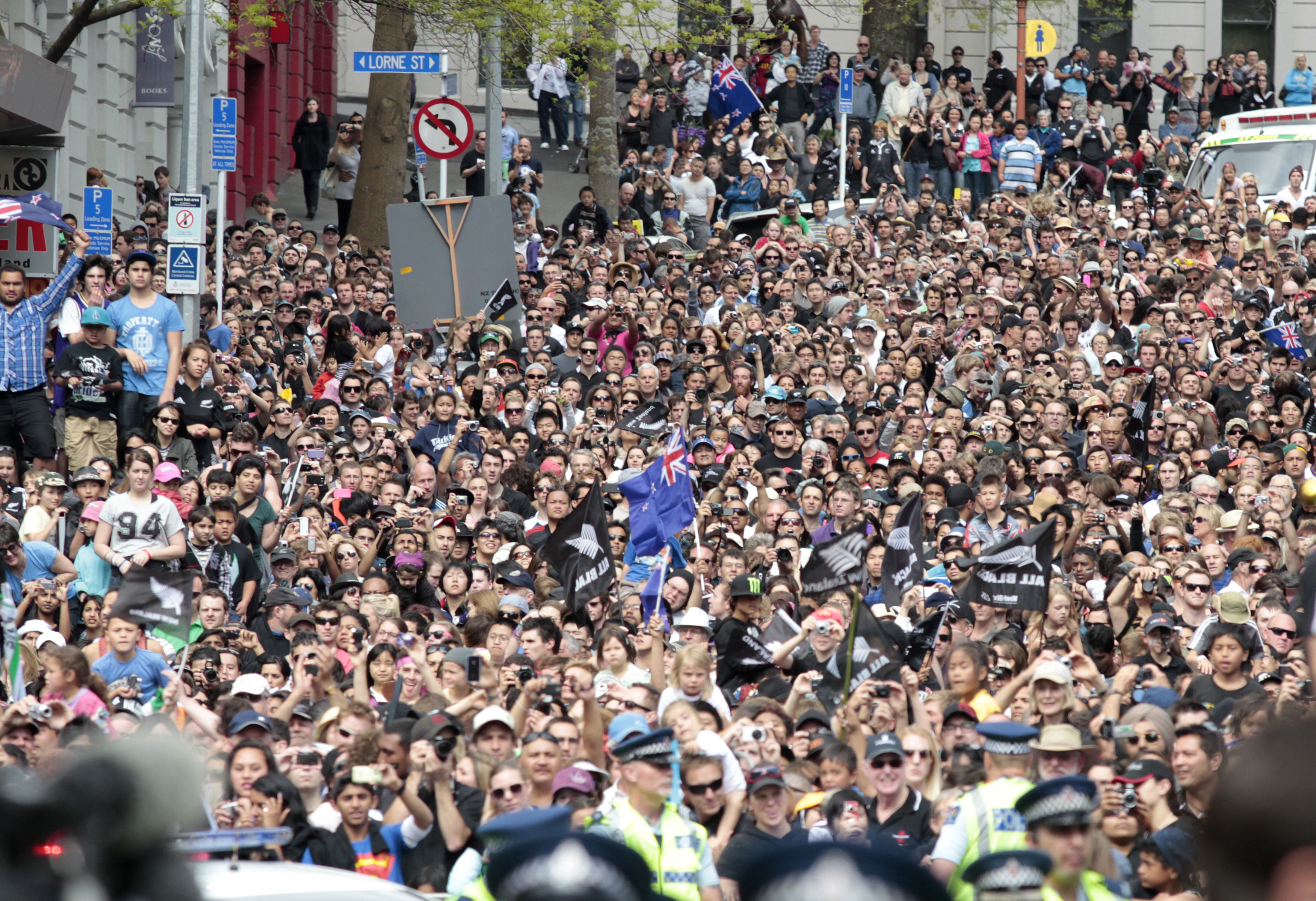 Crowds flock to Queen St for the All Blacks parade after they won the Rugby World Cup 2011, helping New Zealand's mojo. Photo / Natalie Slade