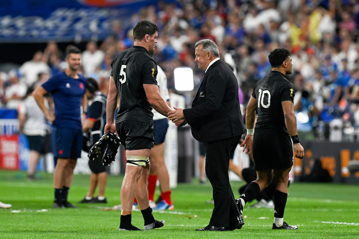A gutted All Blacks coach Ian Foster shakes hands with Scott Barrett following the Rugby World Cup pool play defeat to France. Photo / Photosport