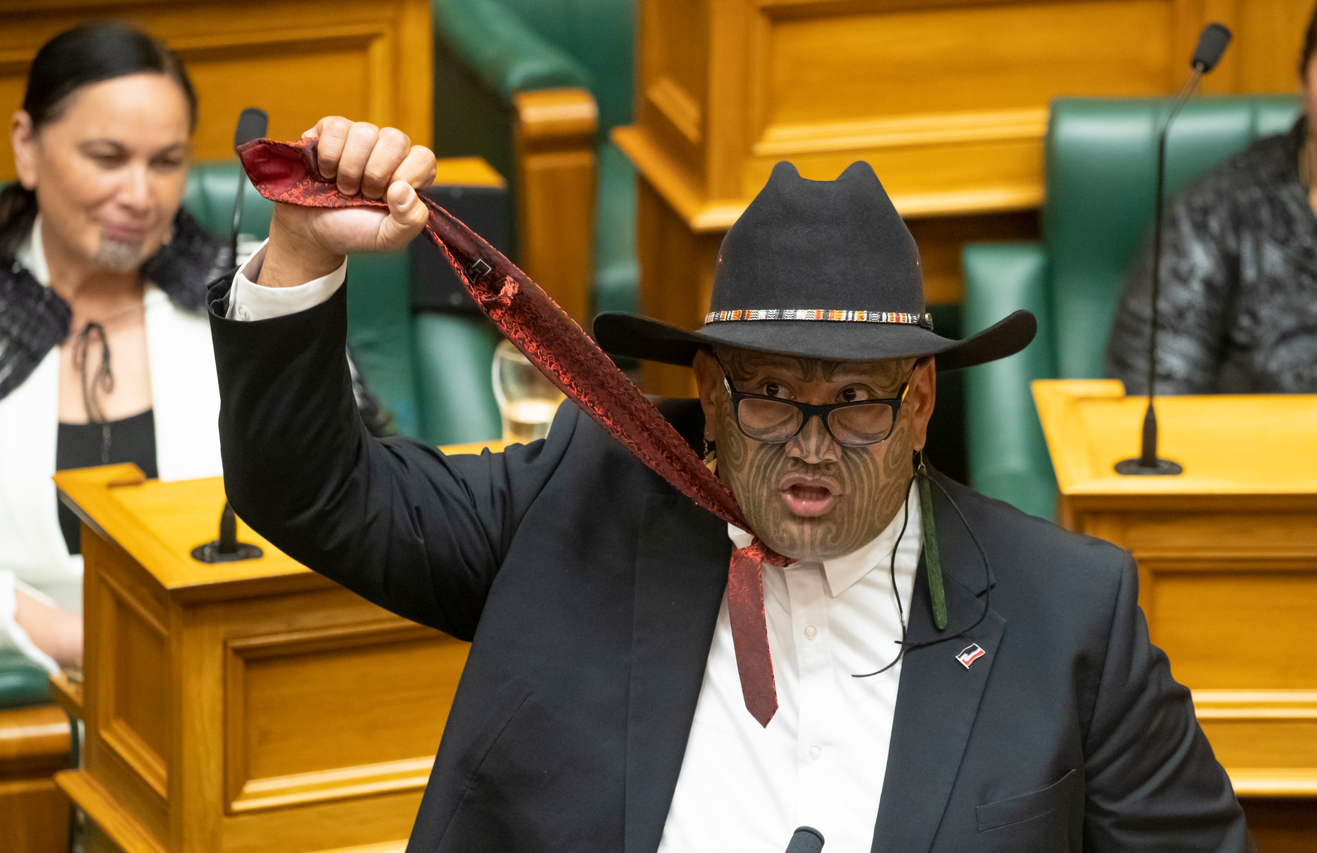 Māori Party co-leader Rawiri Waititi holding his tie aloft to symbolise a noose during his maiden speech in Parliament. Photo / Mark Mitchell