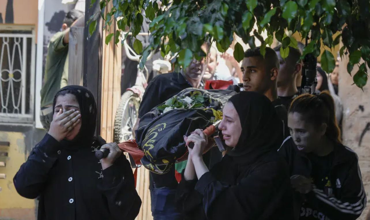 The classmates of 15-year-old Sadeel Naghniyeh during her funeral in the West Bank Jenin refugee camp. Photo / AP