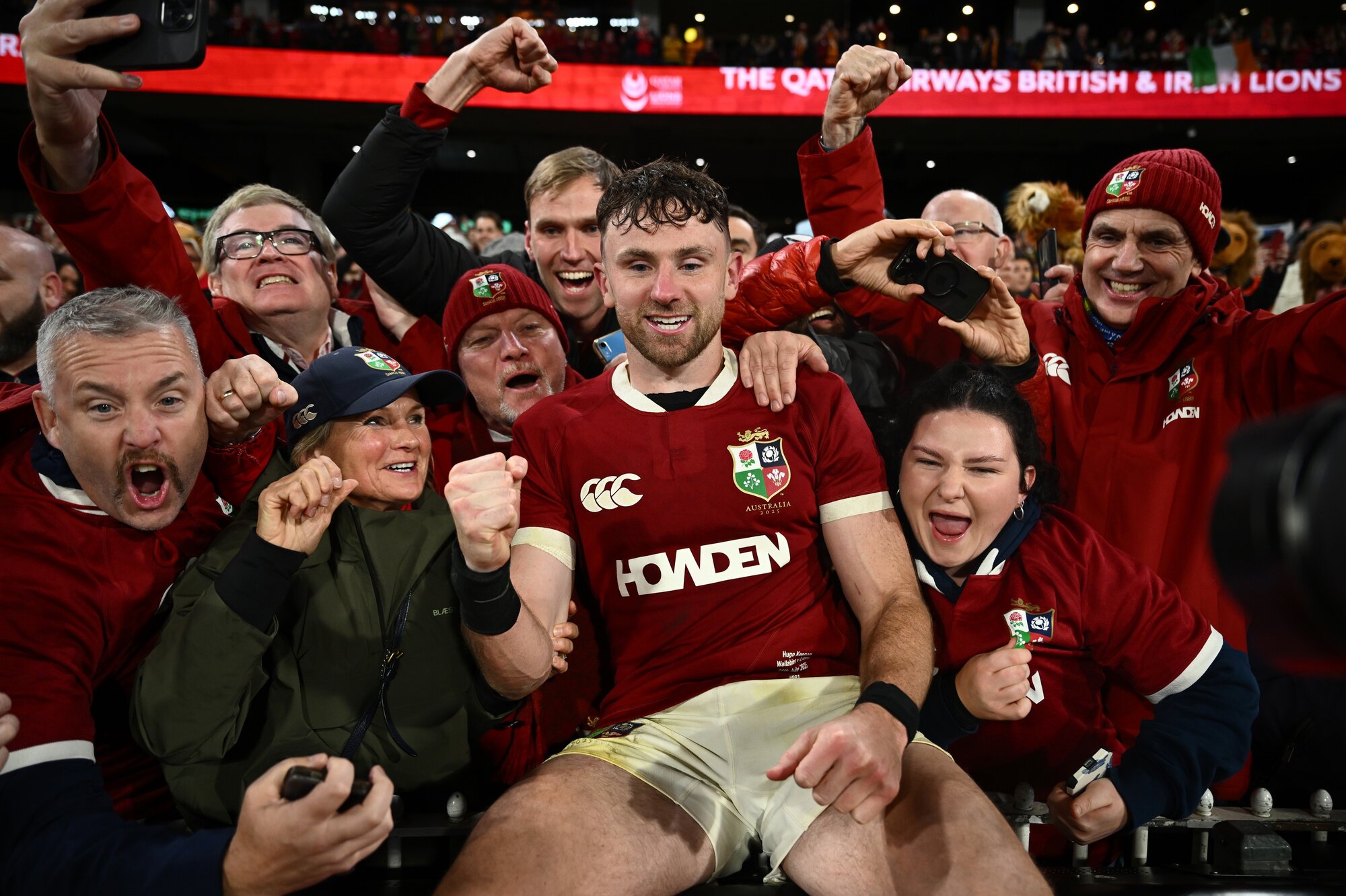 Hugo Keenan celebrates with Lions supporters. Photo / Photosport