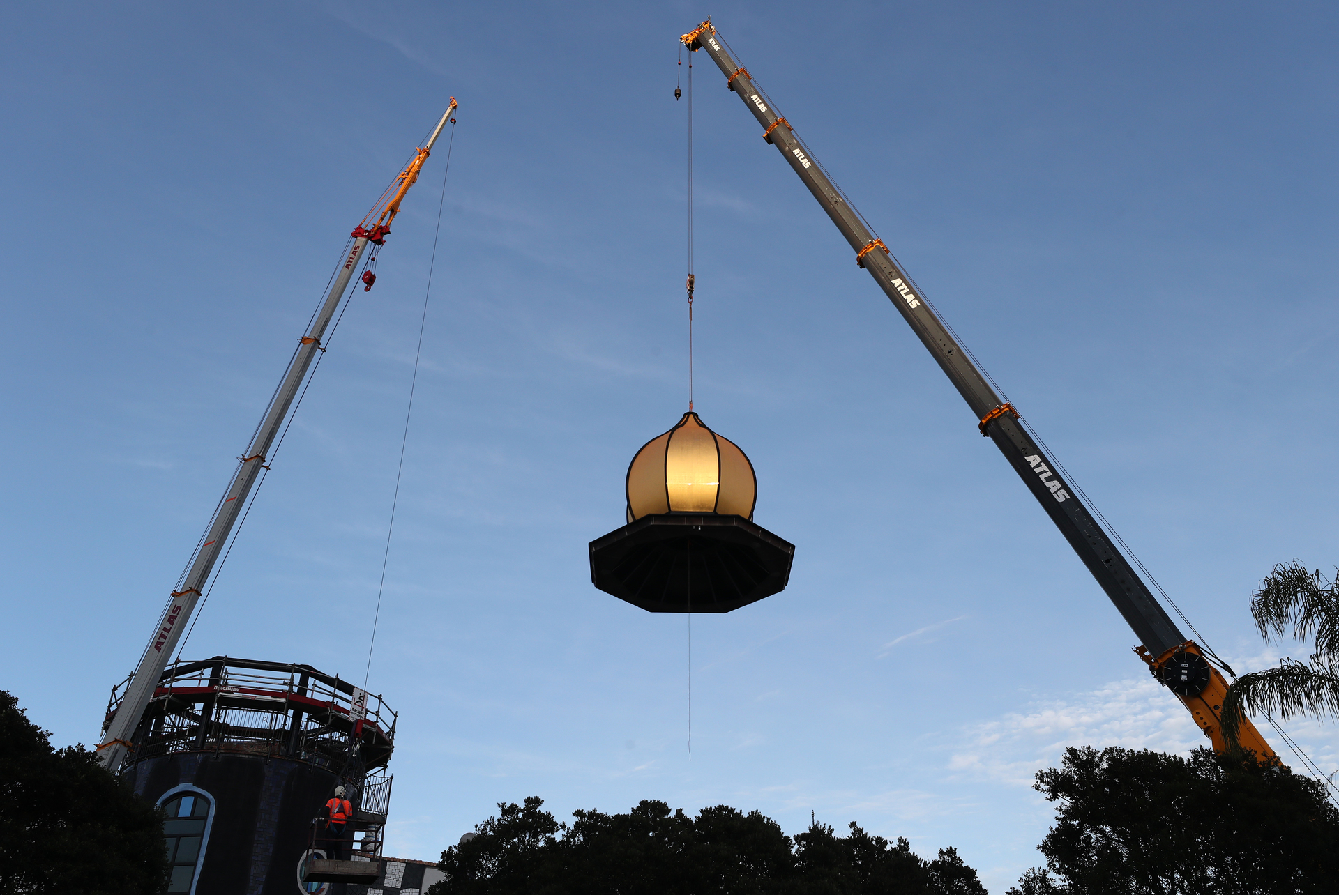 The golden cupola being placed on top of the arts centre Photo / Michael Cunningham 