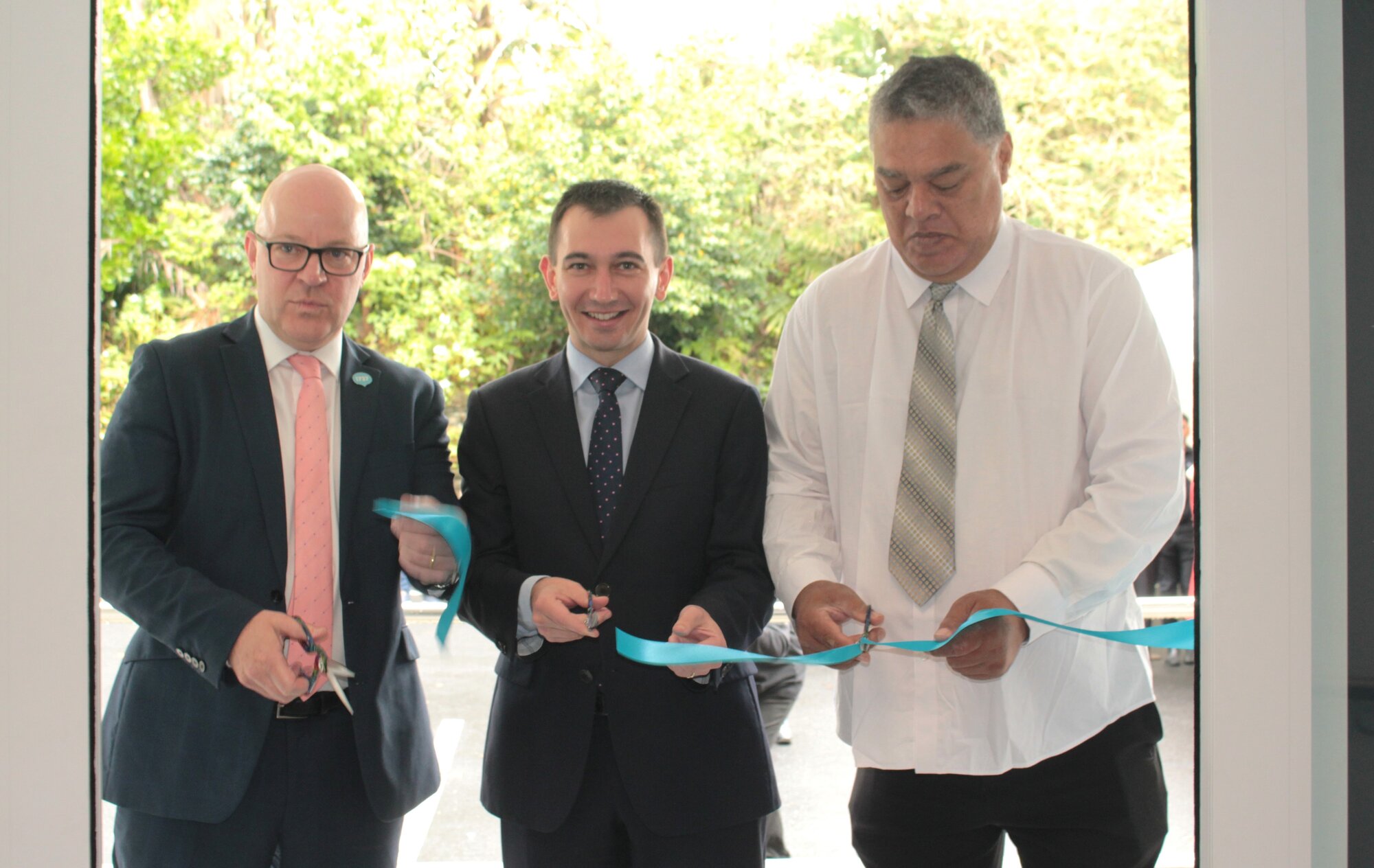 Mental Health Minister Matt Doocey (left), Health Minister Simeon Brown and Arataki Ministries peer support specialist Reuban Carpenter cut the ribbon at the opening of Manaia House in Whangārei on Friday. Photo / Denise Piper