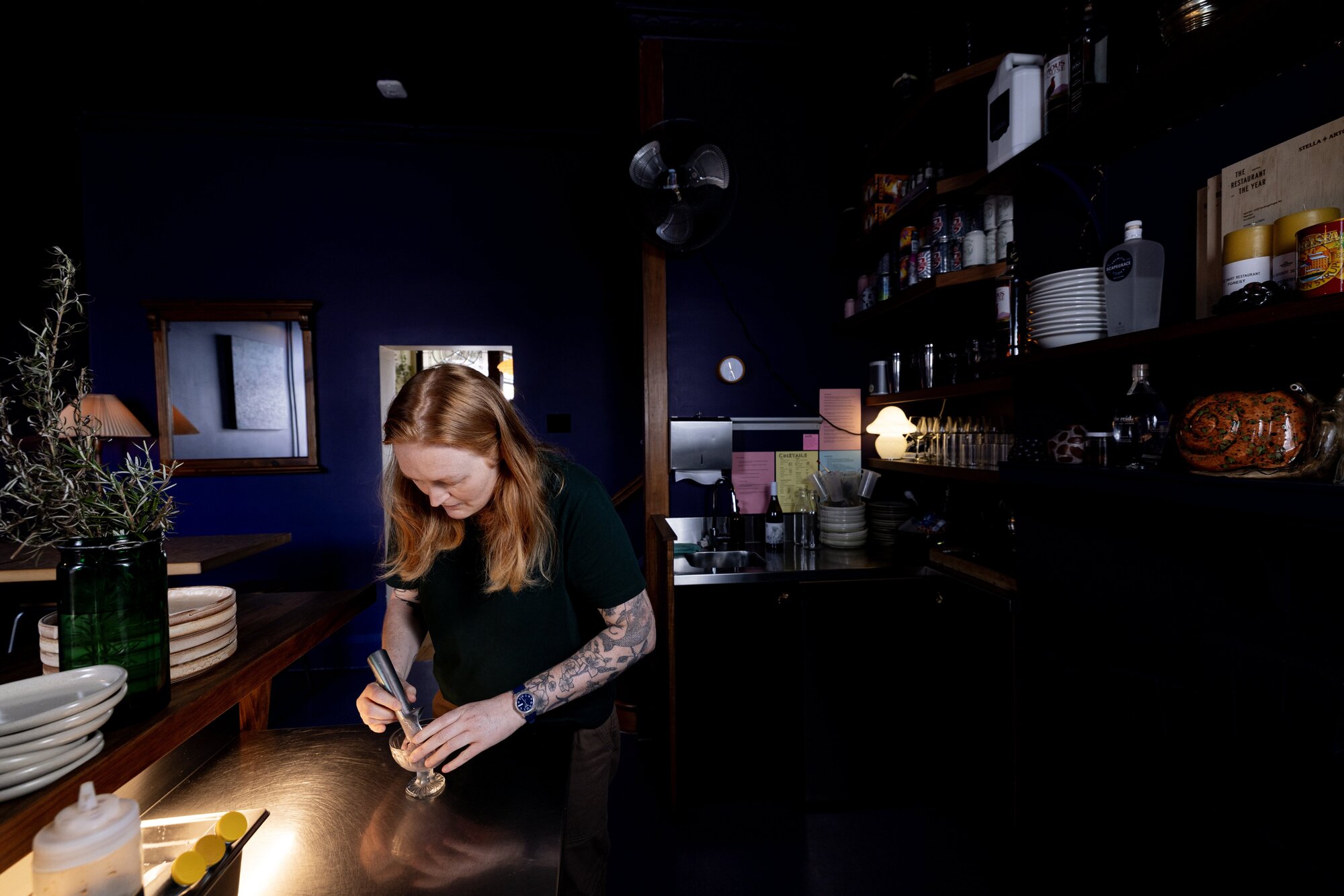 Florence scoops ice cream in her purple dining room. Photo / Dean Purcell