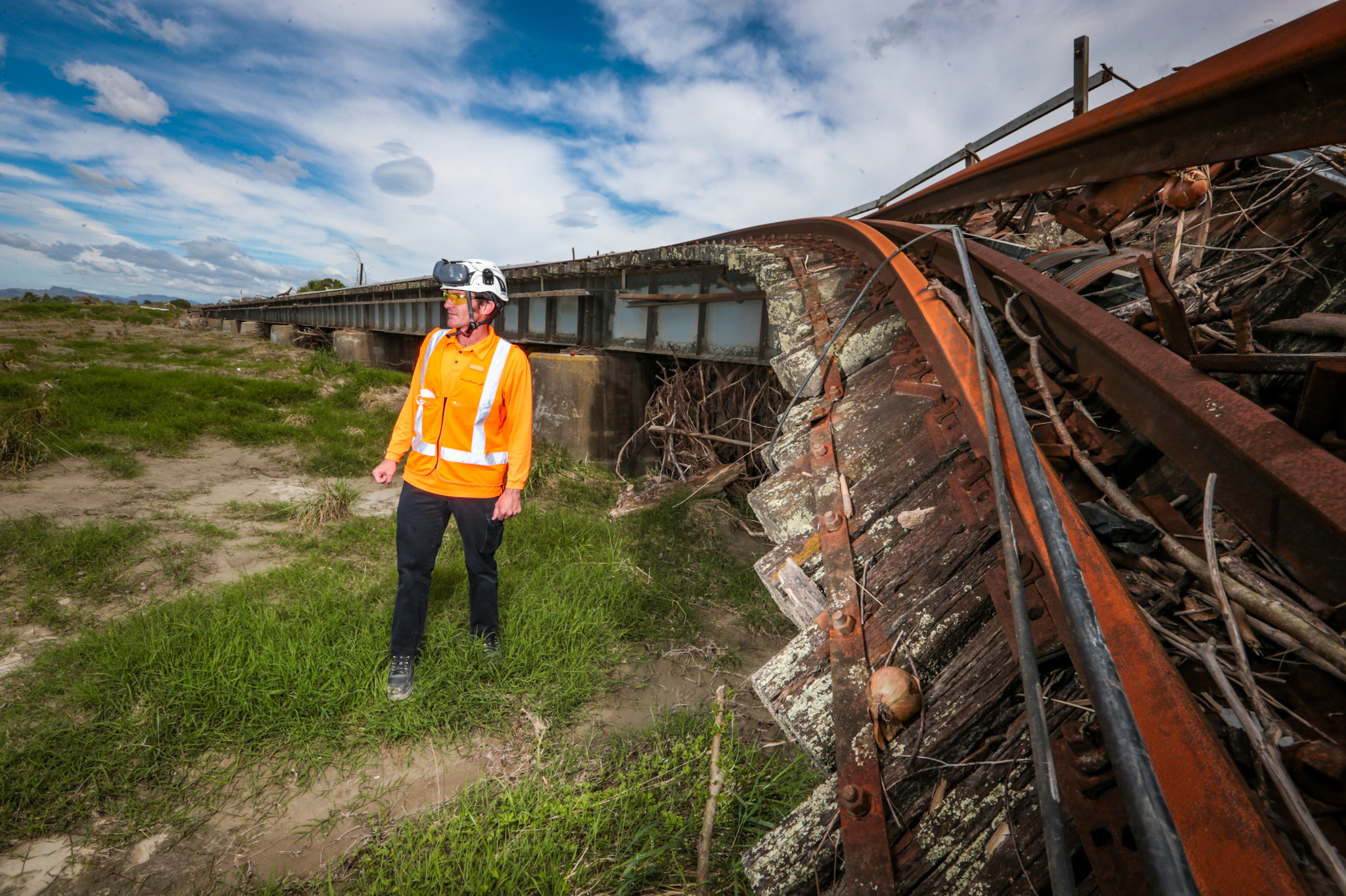 KiwiRail programme director Daniel Headifen next to the destroyed Waitangi Washout Bridge, near Awatoto. Photo / Paul Taylor