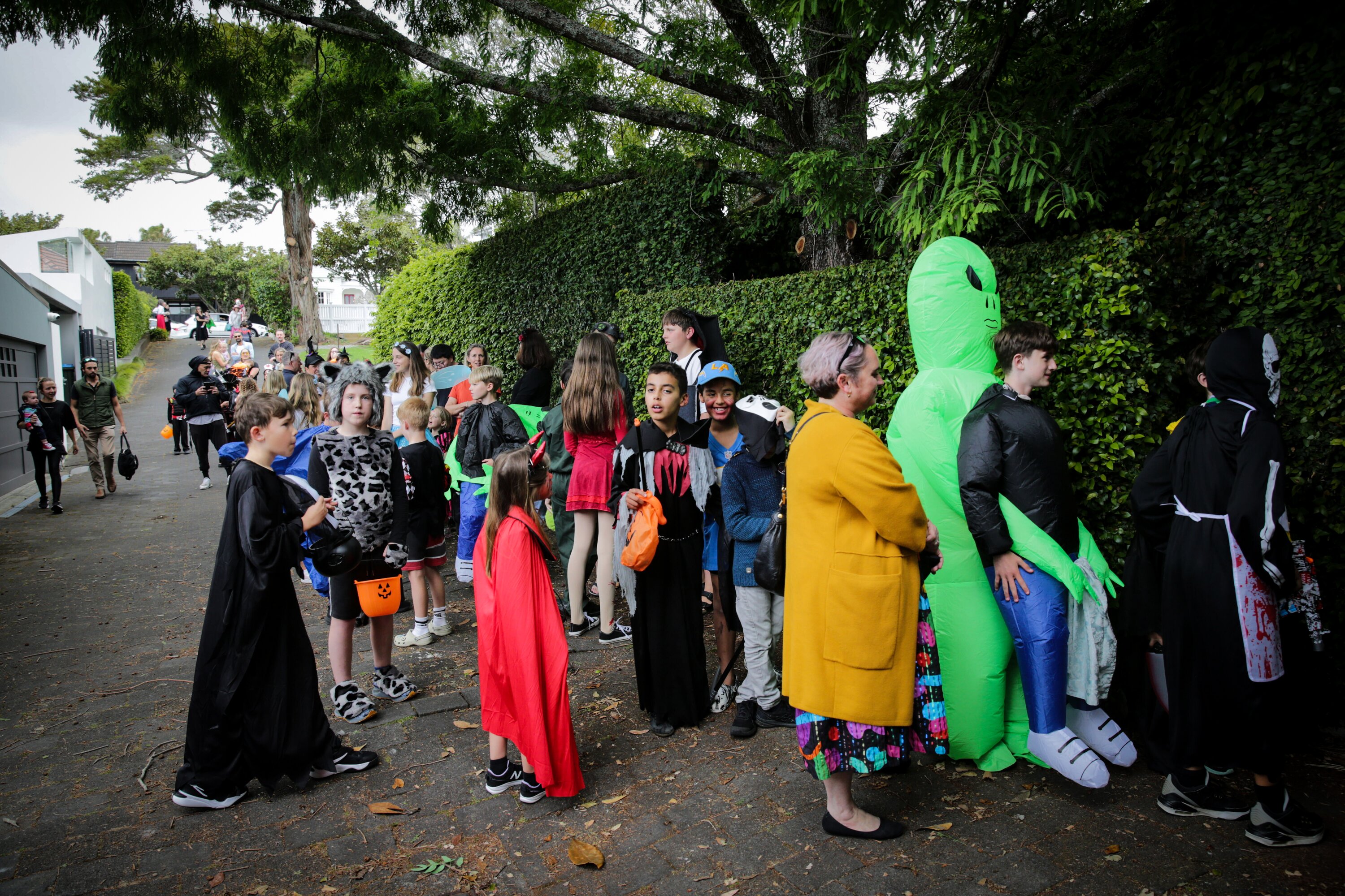 Many children in their scary best queued outside the Zuru founder's Mowbray house in Herne Bay. Photo / Sylvie Whinray