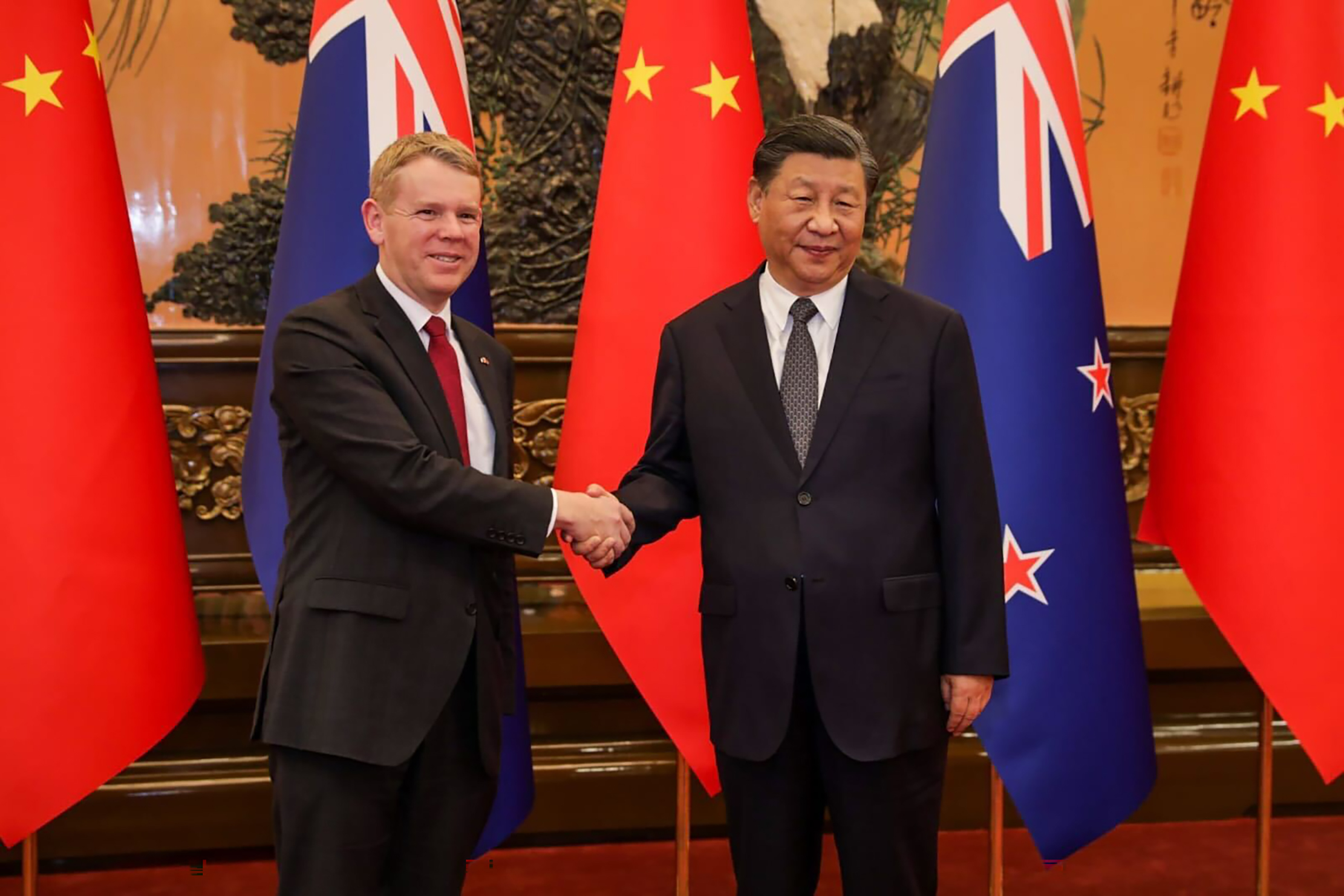 Prime Minister Chris Hipkins and Premier Xi Jinping shake hands in the Great Hall of the People in Beijing on Tuesday. Photo / Nathan McKinnon