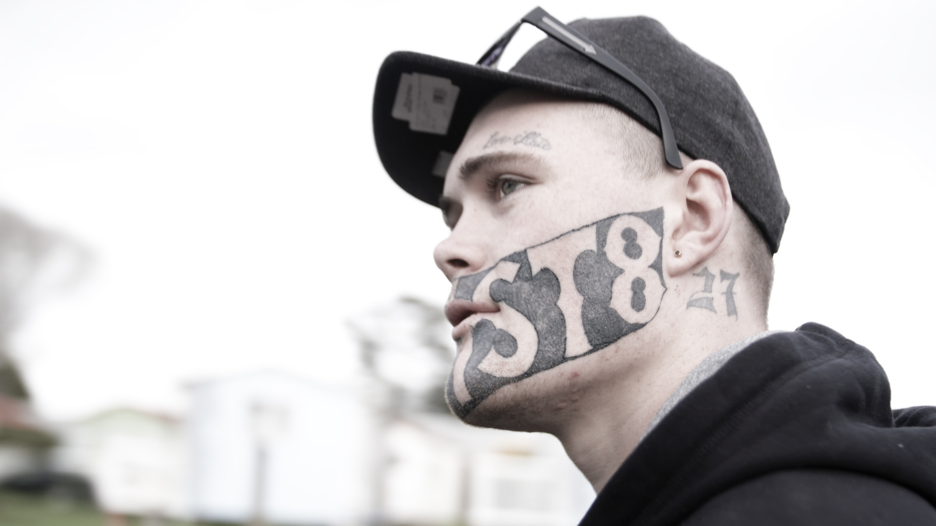 Man with 'DEVAST8' face tattoo decides to keep it after starting new job |  The Independent | The Independent