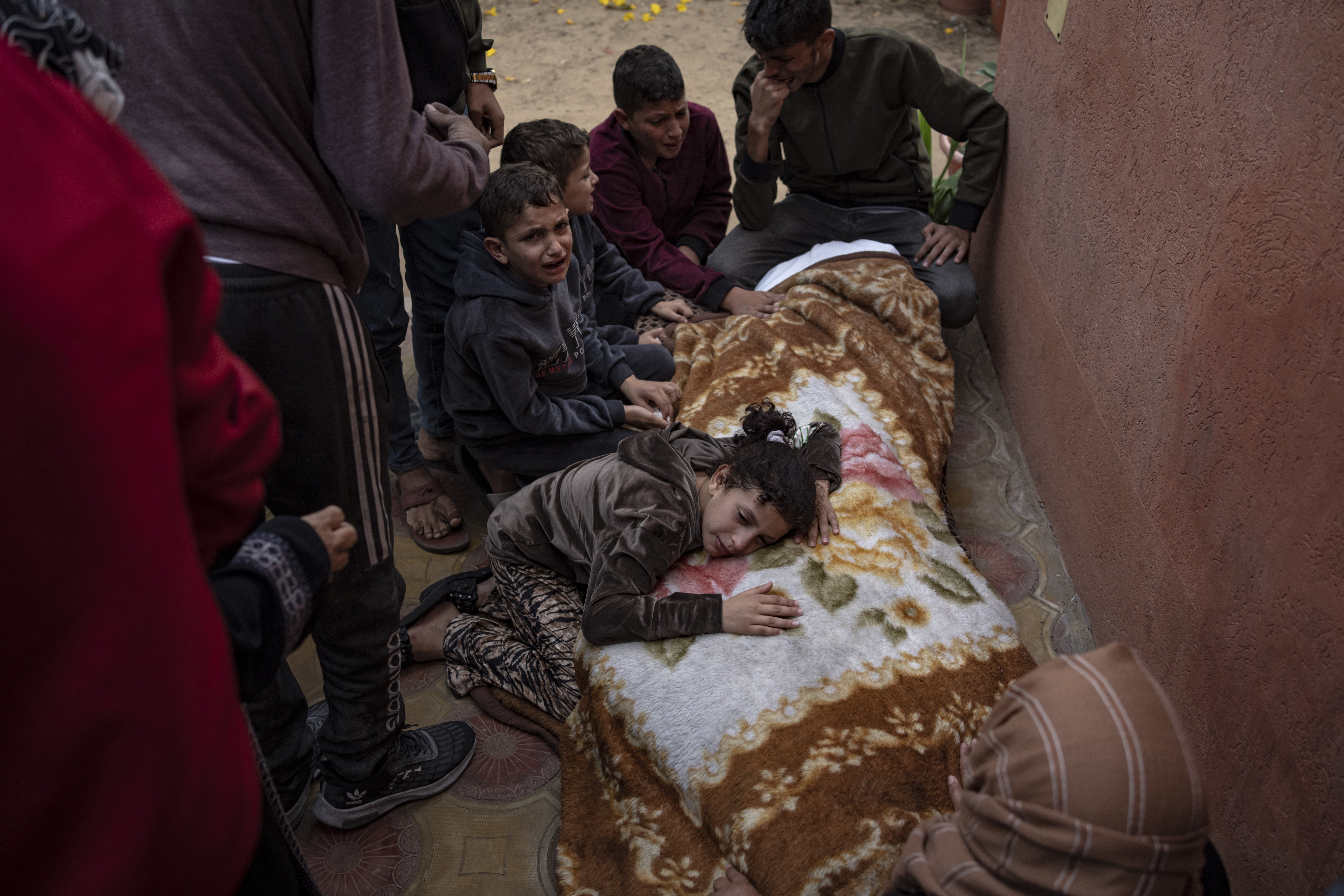 Palestinian children mourn their dead family at the hospital in Khan Younis, on November 11. Photo / AP  