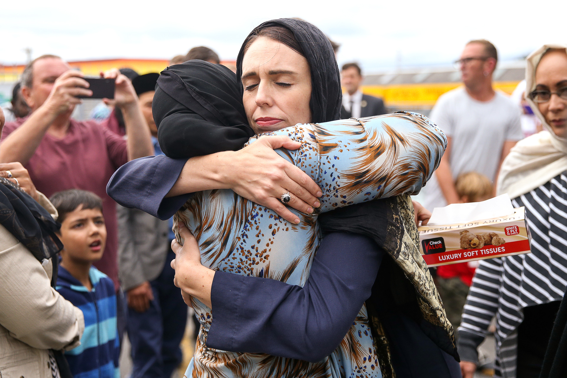 Prime Minister Jacinda Ardern hugs a mosque-goer at the Kilbirnie Mosque on March 17