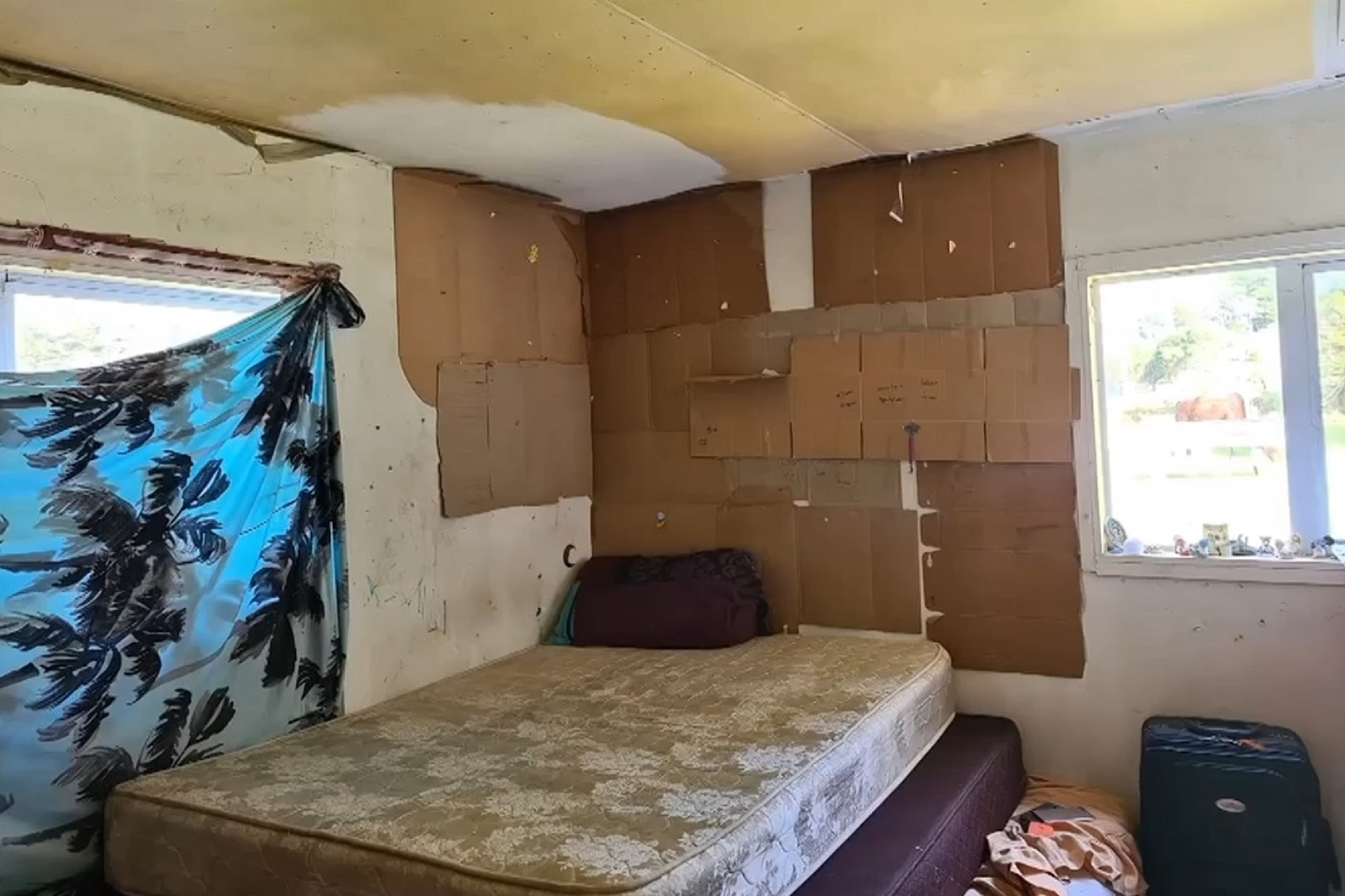 The kaumātua's house is lined with cardboard and the windows are bordered up with corrugated iron. Photo / Supplied