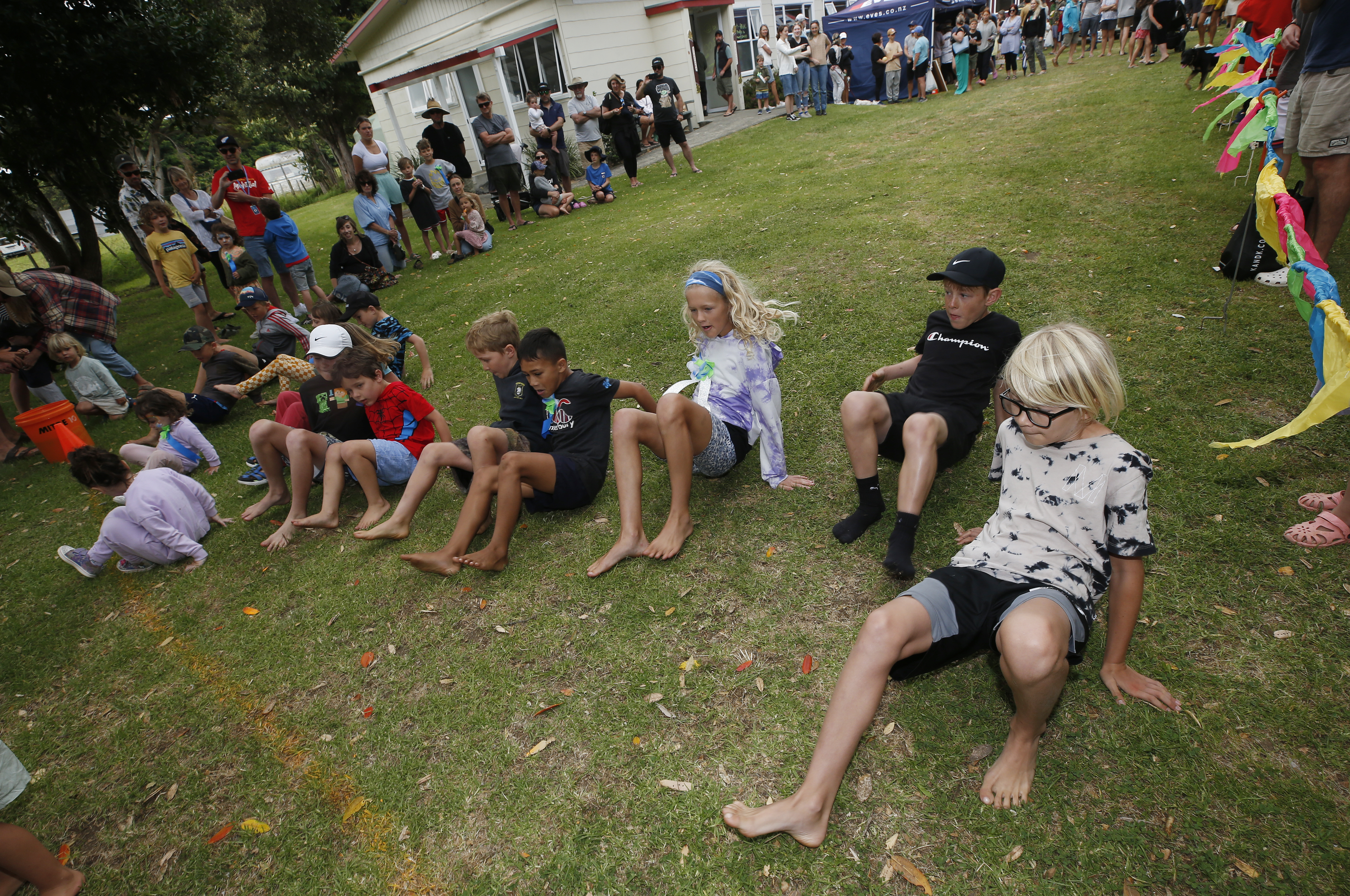 The competitors get down for the crab race at Matapouri.