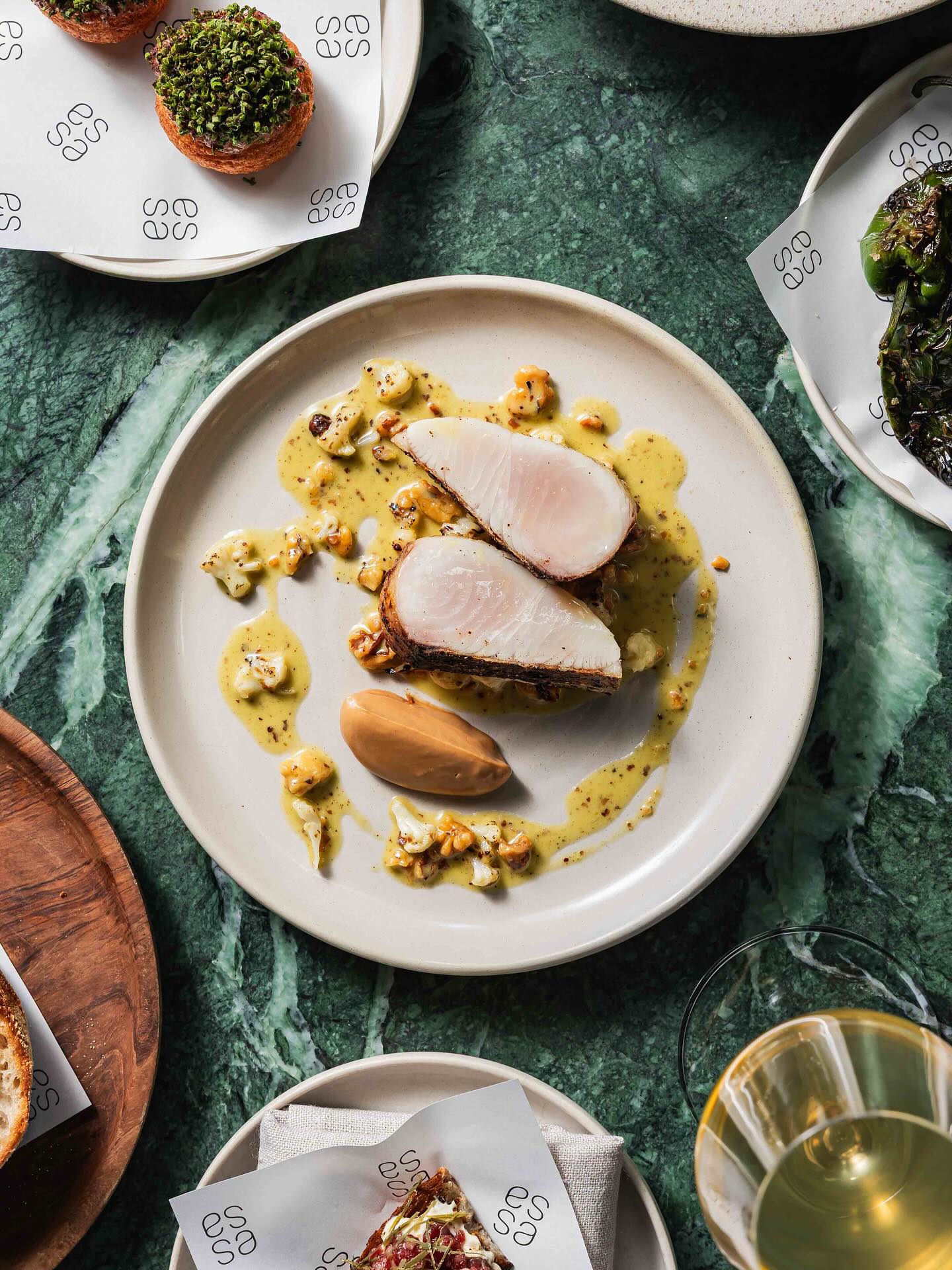 Essa’s woodfired Spanish mackerel with cauliflower, walnut and kombu butter sauce. Photo / Instagram, @ Essa.Restaurant