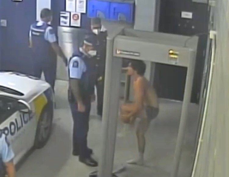 Jamie Lawry after being arrested by police in 2022. He stripped naked after repeatedly setting of a metal detector. 